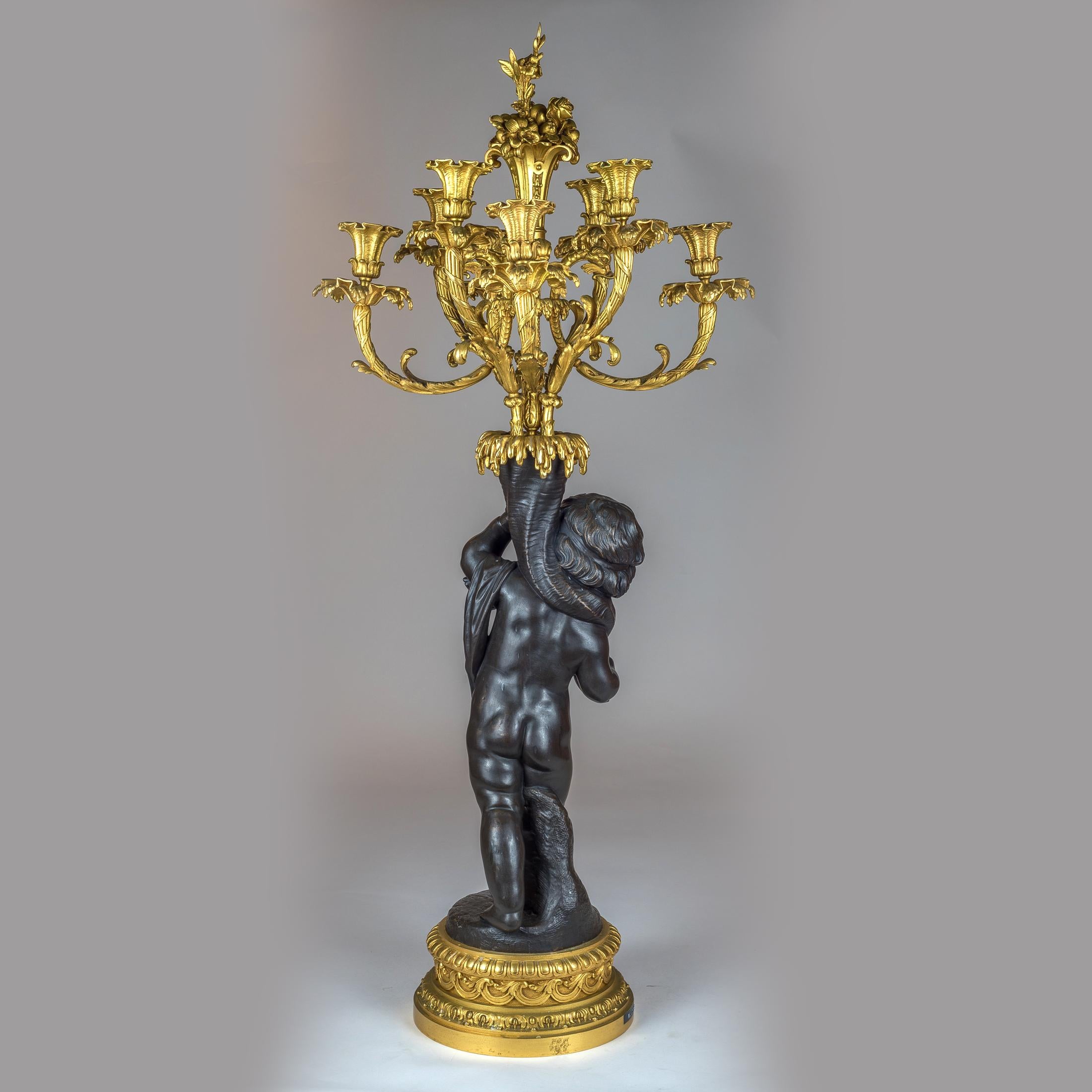 High Quality Pair of Patinated and Gilt Bronze Figural Candelabras In Good Condition In New York, NY