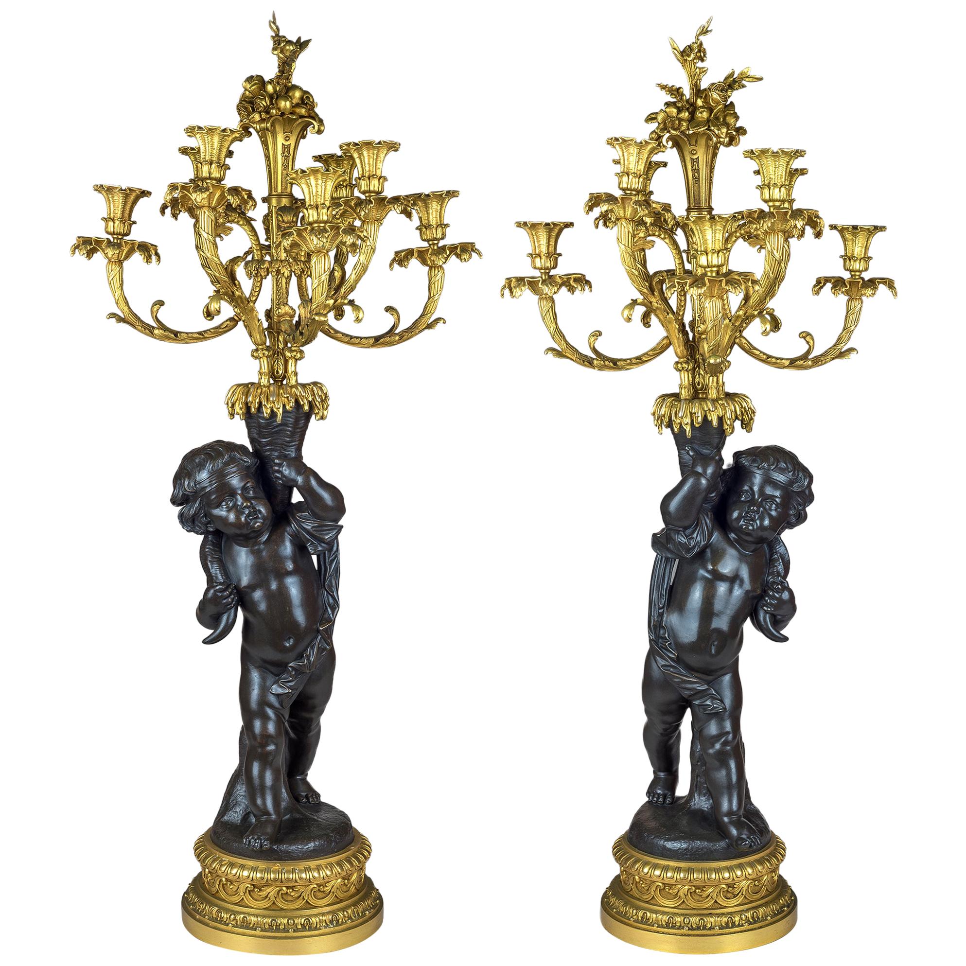 High Quality Pair of Patinated and Gilt Bronze Figural Candelabras