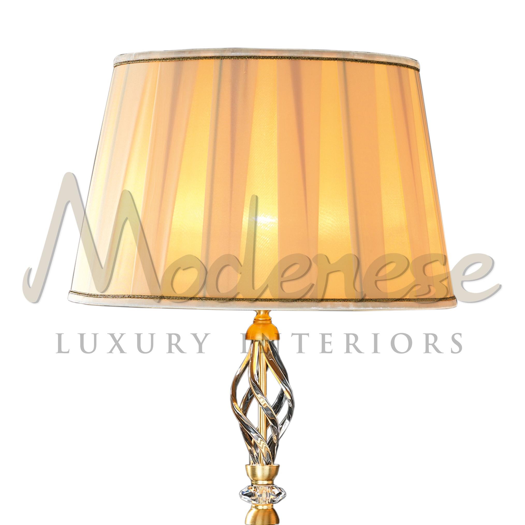 Have yourself be seduced by this combination of timeless classic elements: elegant brass base, adorned with sparkling transparent crystals, gold satin finish and exquisite fabric lampshade by Modenese Luxury Interiors. This model requires 1 single