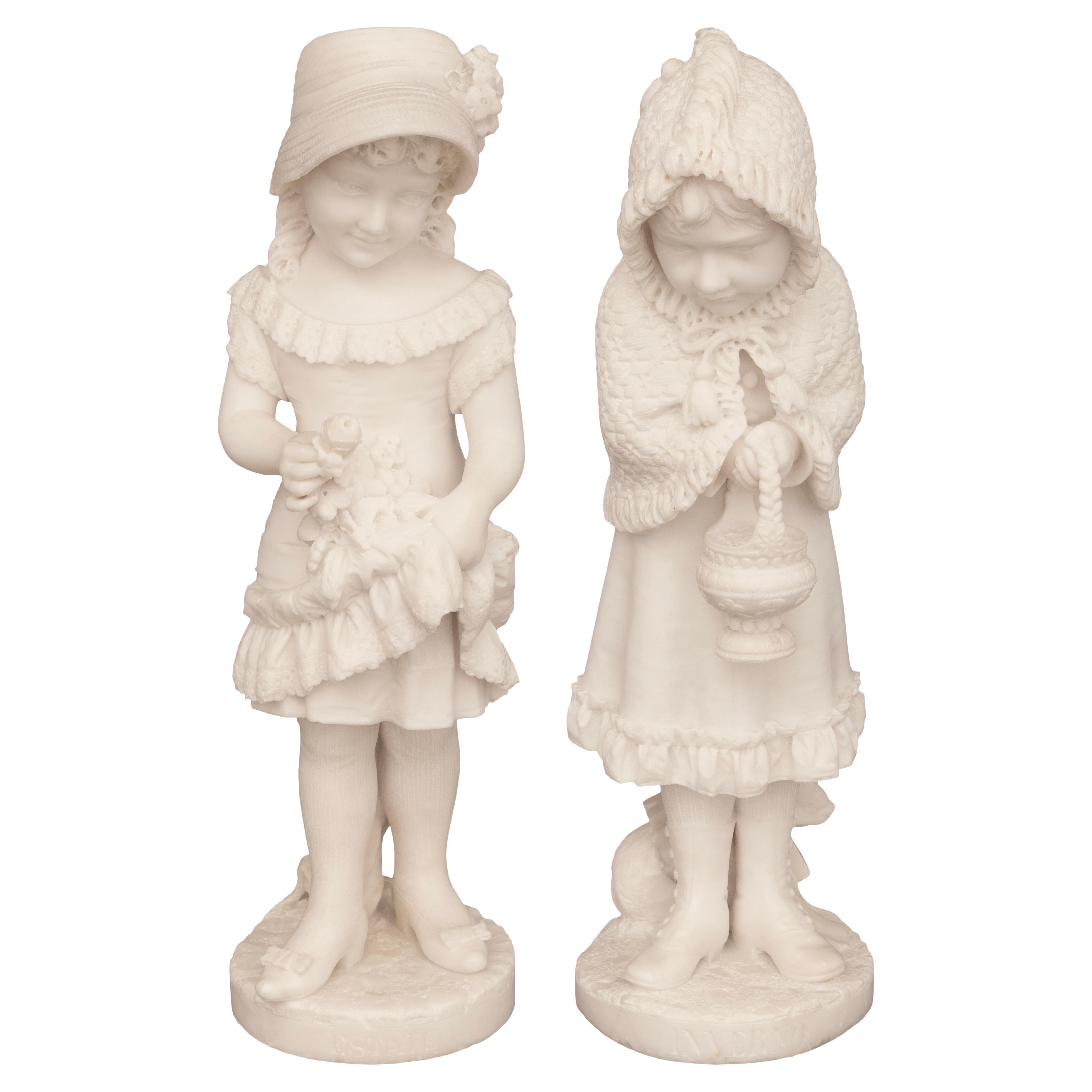 A lovely and high quality true pair of Italian 19th century white Carrara marble statues, signed Cesare Lapini. Each wonderful statue is raised on a circular ground designed base where each of the charming young girls above are standing. Showcased