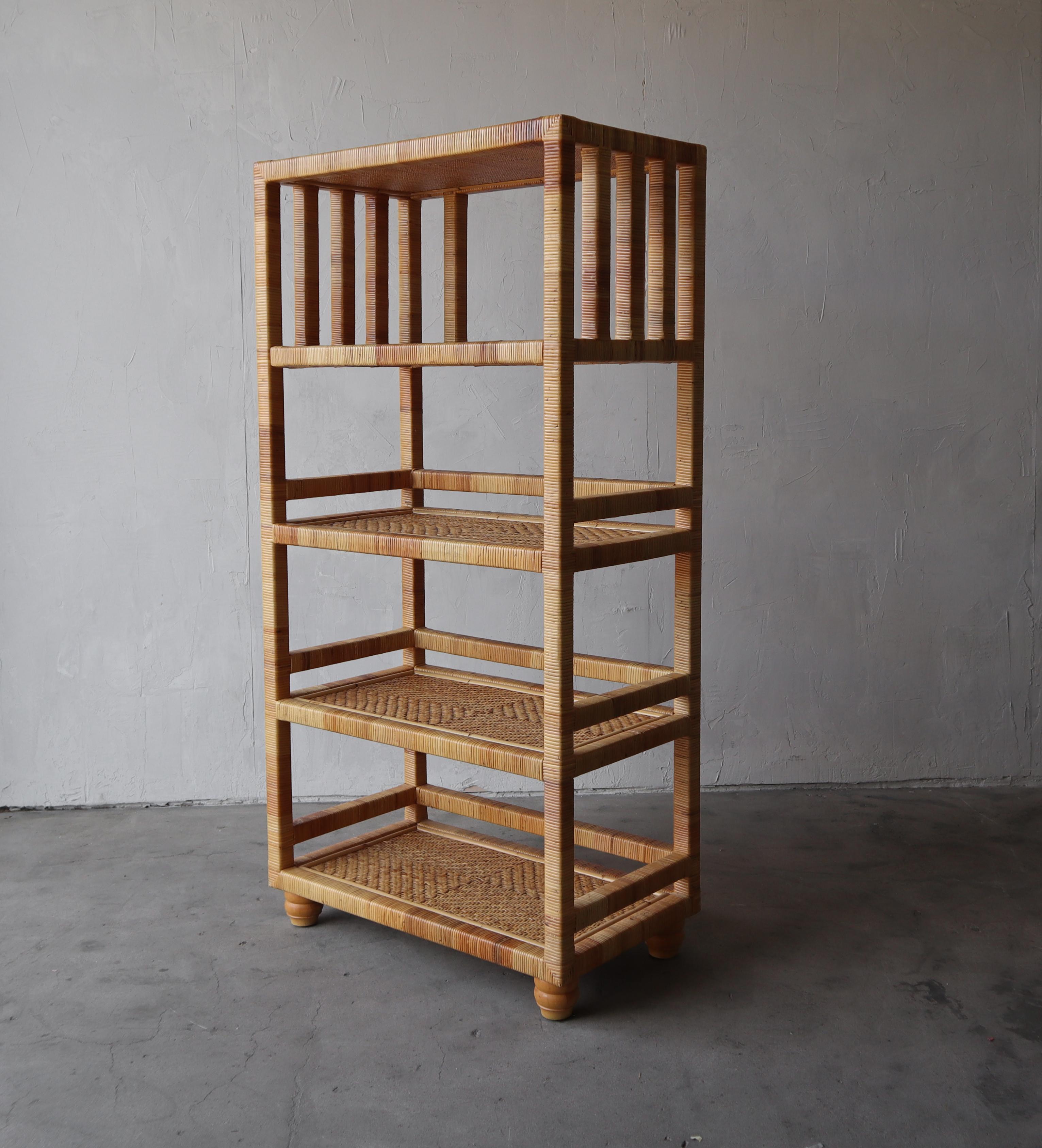 Great vintage vintage bookshelf in pristine condition. Unlike a lot of wicker pieces this bookshelf is very high quality and very well made, its actually quite heavy. Each shelf is reinforced and could actually be used for books.

There are no