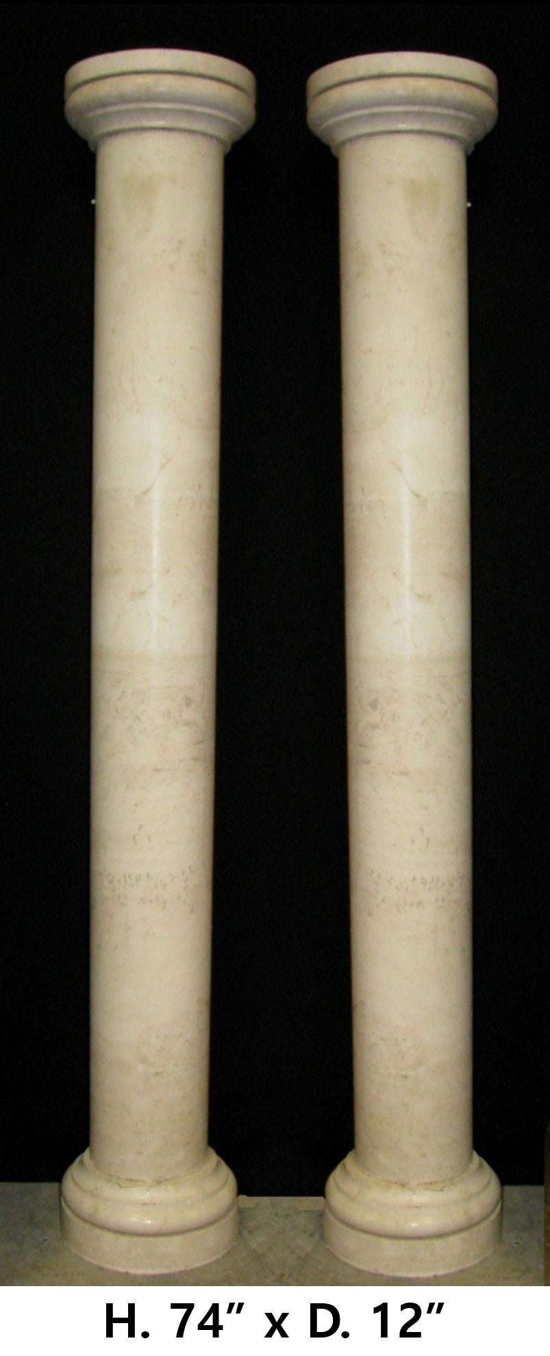 Monumental Roman style carved beige marble columns with round capital on top and bottom
H. 74
