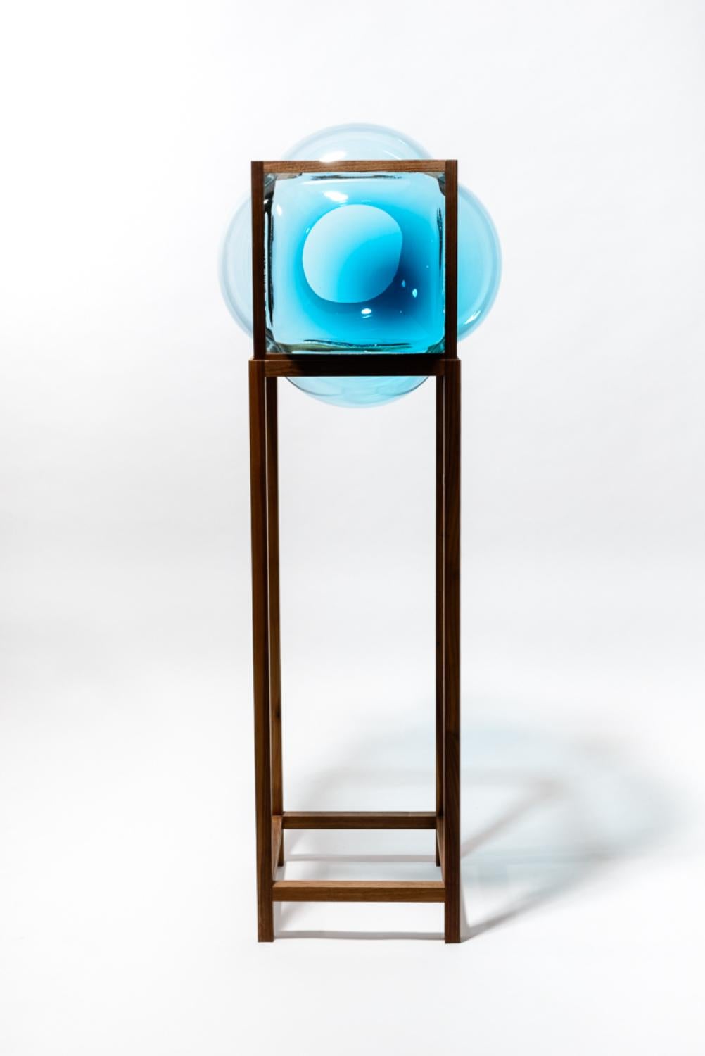 High round square cabinet by Studio Thier & van Daalen
Dimensions: W 45 x D 45 x H 120cm
Materials: Wood, Glass
Also Available: Other options available.

When blowing soap bubbles in the air Iris & Ruben had the dream to capture these temporary