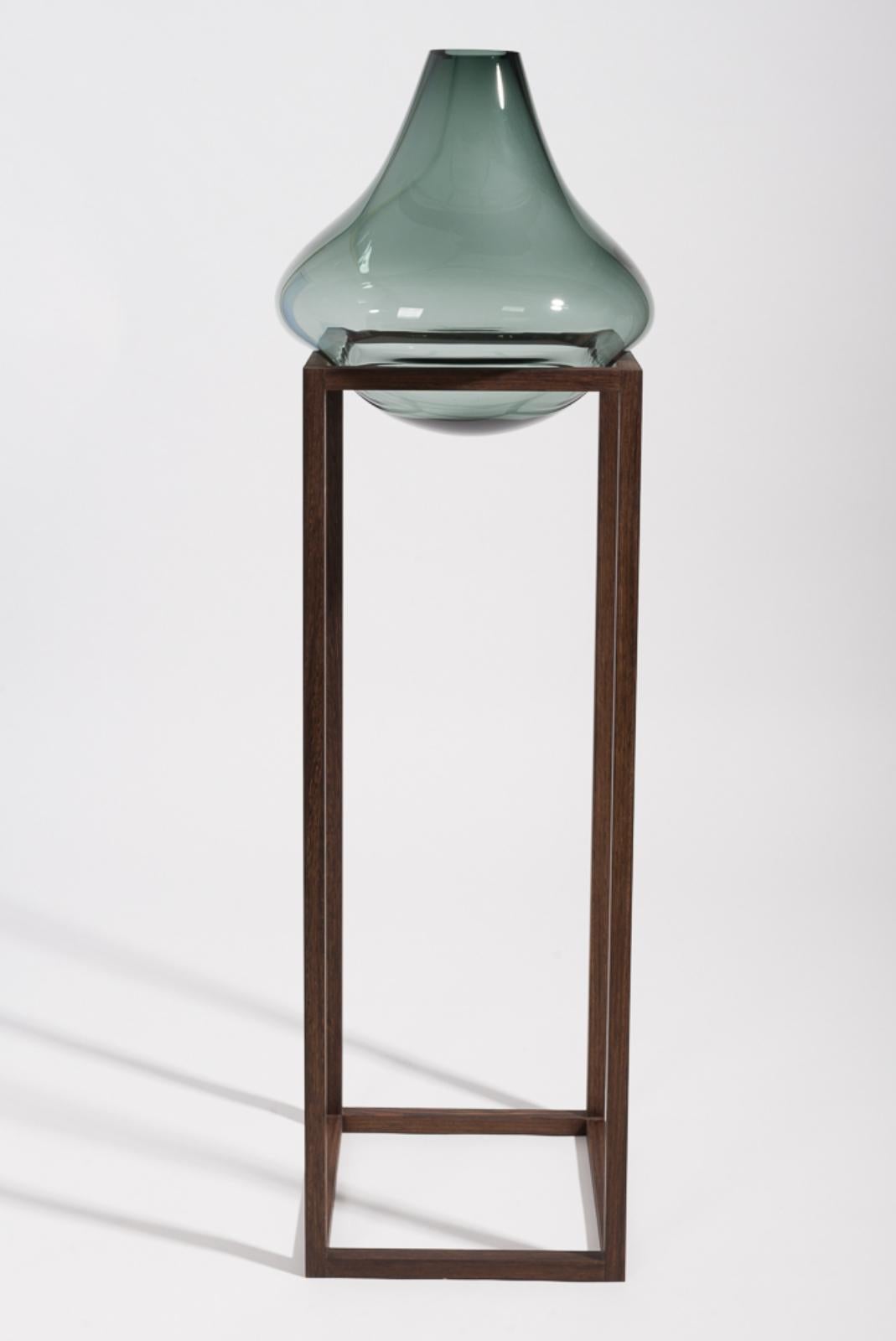 High round square green vase by Studio Thier & van Daalen
Dimensions: W 36 x D 36 x H 120 cm
Materials: Wood, Glass

When blowing soap bubbles in the air Iris & Ruben had the dream to capture these temporary beauties in a tendril frame. The