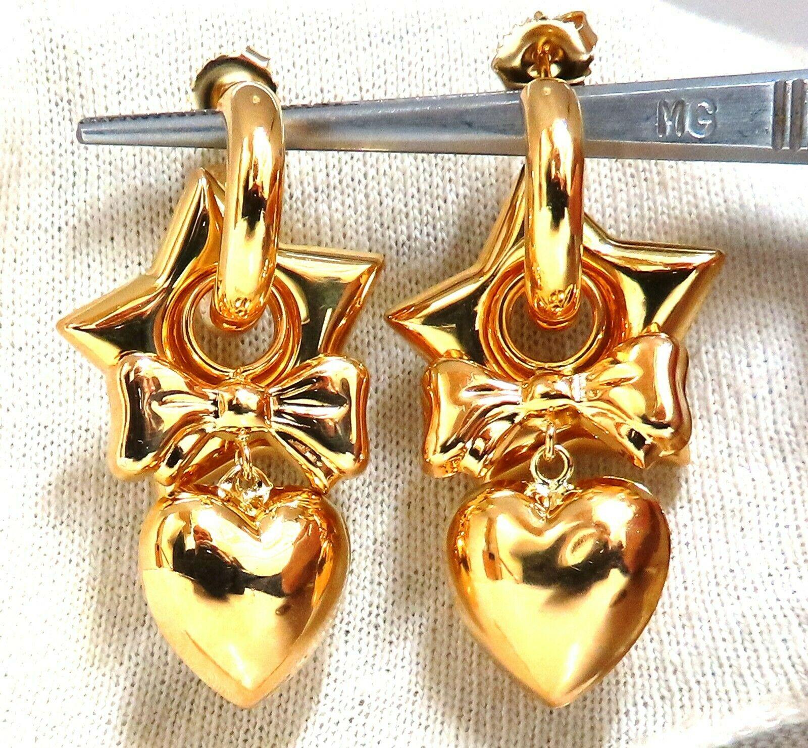 High shine Domed Heart, Star, Bow & Hoop Dangle earrings

Measurements of Earrings:

.89 inch wide 

1.8 inch long

9.9 grams / 14kt. yellow gold

Butterfly Push back Comfort

Earrings are gorgeous made