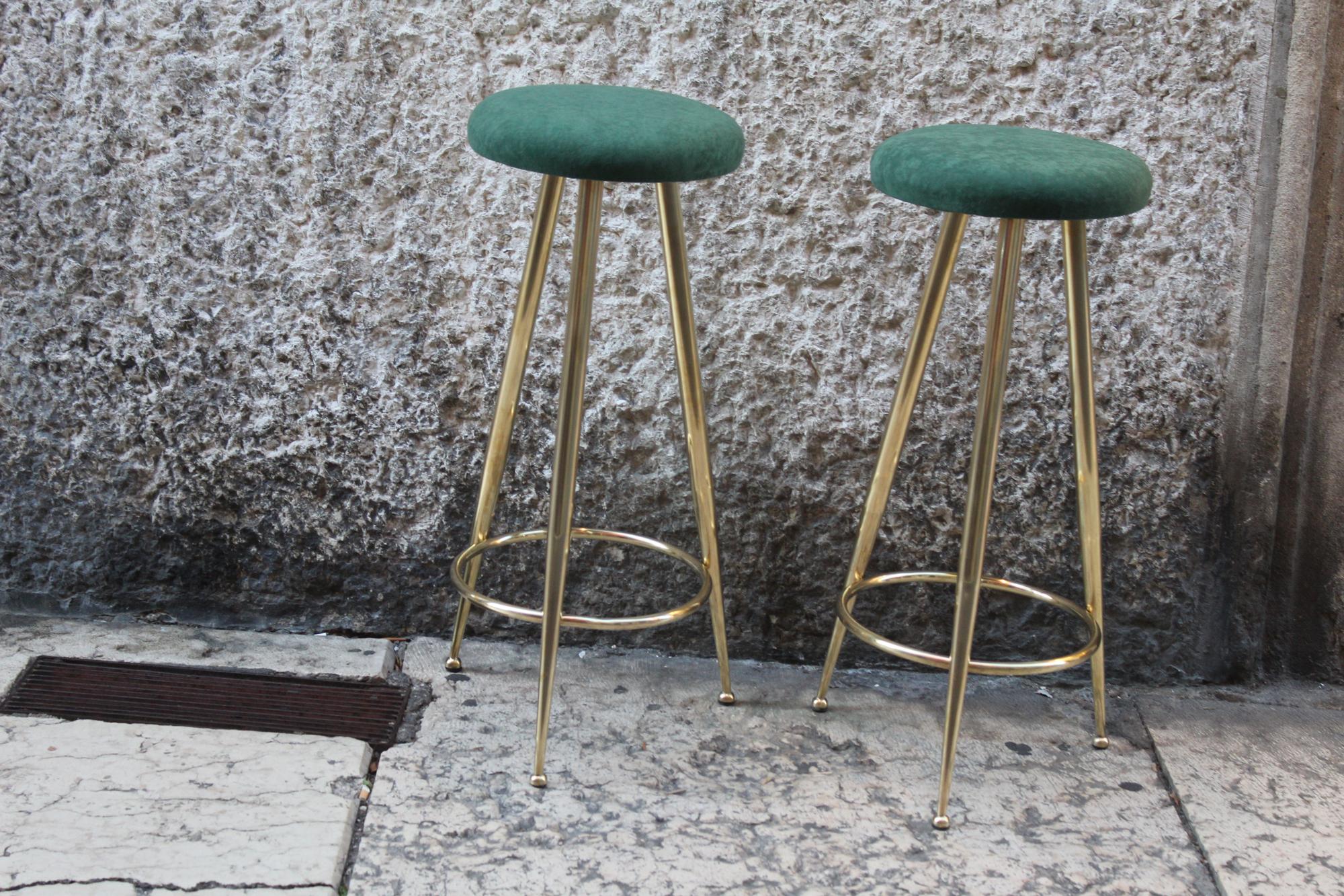 Couple of high stools, heels brass legs. Tapestry has been renovated in green velvet.
 