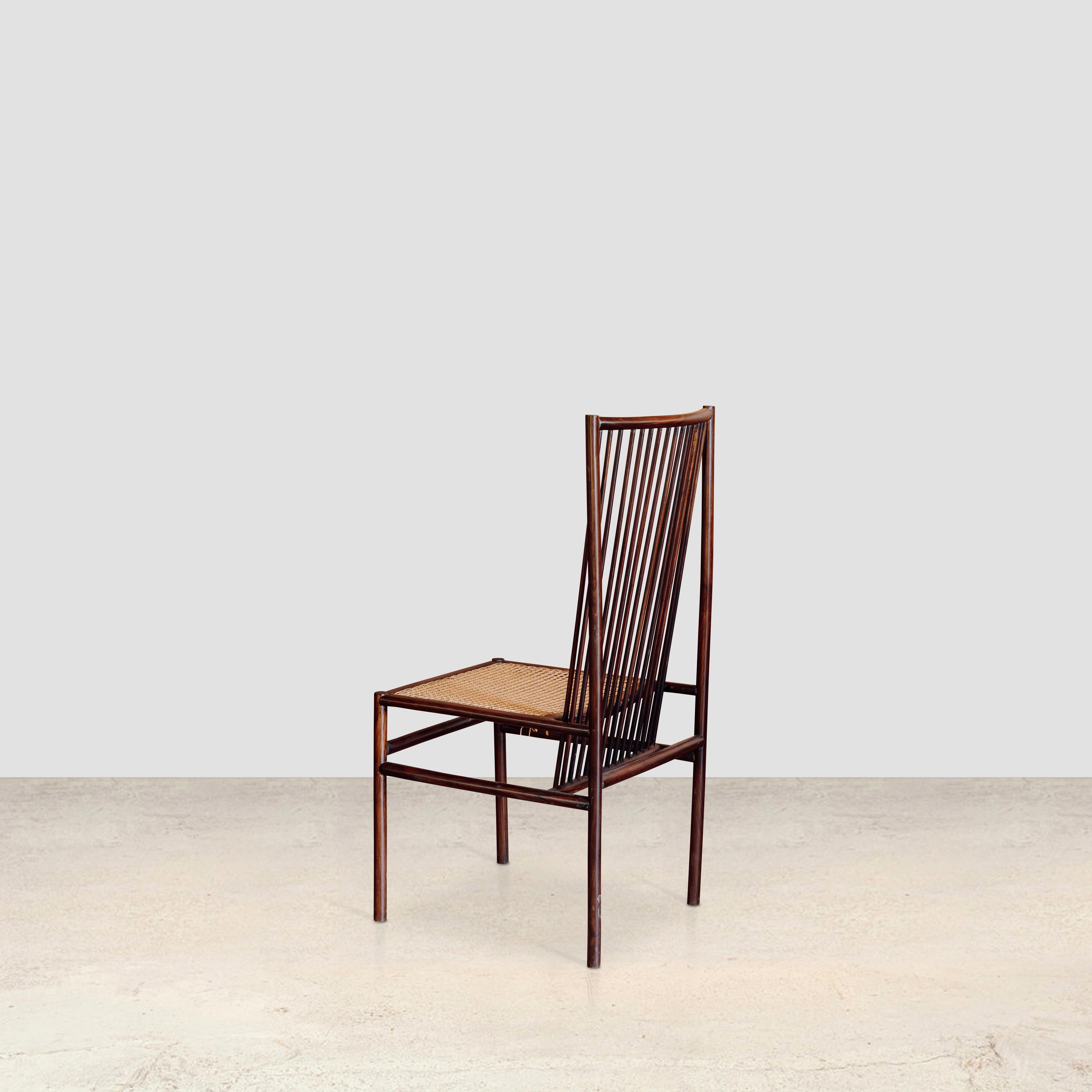 High structural cane chair 
by Joaquim Tenreiro

To compose light seats, Tenreiro used thin wooden sticks in some of his chairs. One of these pieces, which became well known, was the structural chair. Created in 1947 in two versions, one with a