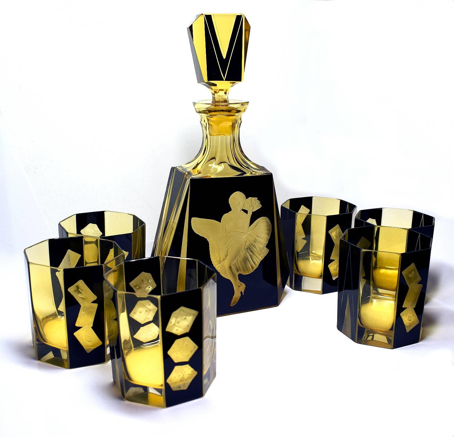 Fabulous 1930s Art Deco decanter set by Karl Palda. Comprises a heavy cut-glass decanter, stopper and six tumbler glasses, all with enamel geometric decoration and etched games design. This rare set oozes quality. All in perfect condition. The