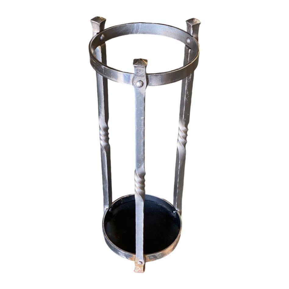 Elevate your entryway with this sleek High Style Chromed Iron Art Deco Umbrella and Cane Holder Stand. Its sophisticated design blends seamlessly with modern or vintage decor, offering a practical and stylish solution for organizing umbrellas and