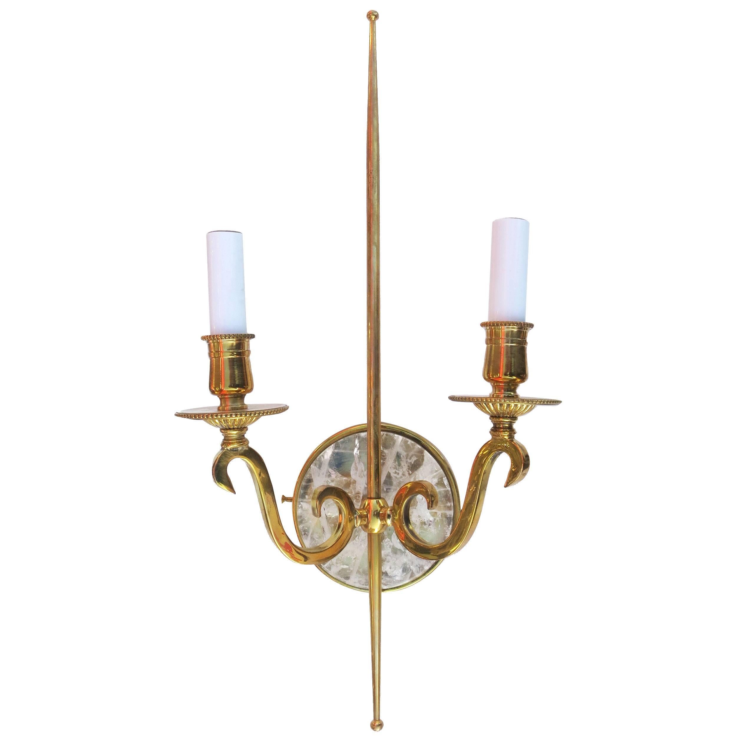 High style double arm wall sconce made from solid brass castings with a natural rock crystal stone center. 

Product handcrafted in the USA with the highest quality materials and over 30 years of experience in luxury: lighting (chandeliers, floor