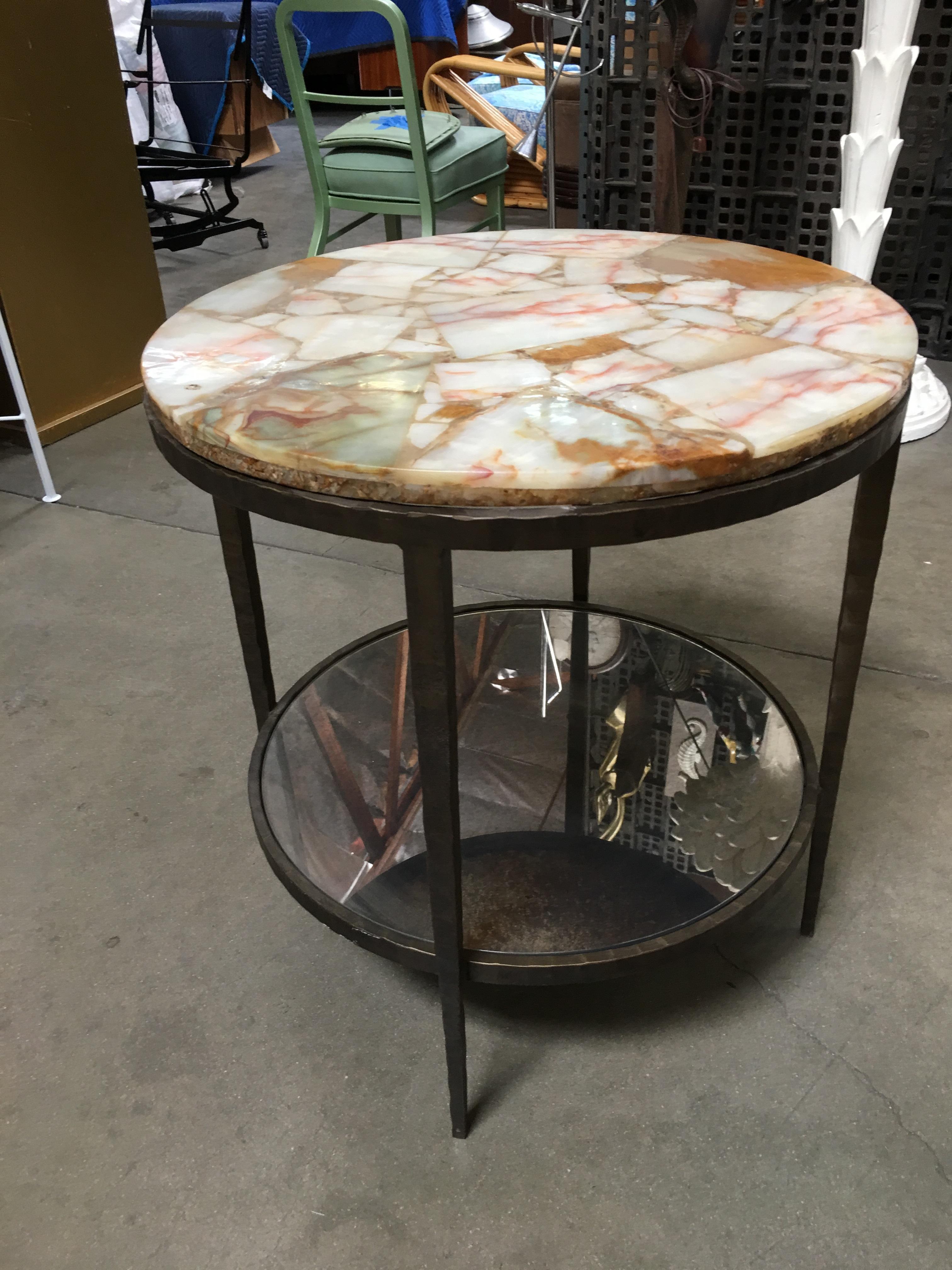 High style round two-tier side table featuring a hand-forged 4 leg bronze frame with a composite marble top and mirrored second shelf.

Circa 1980 