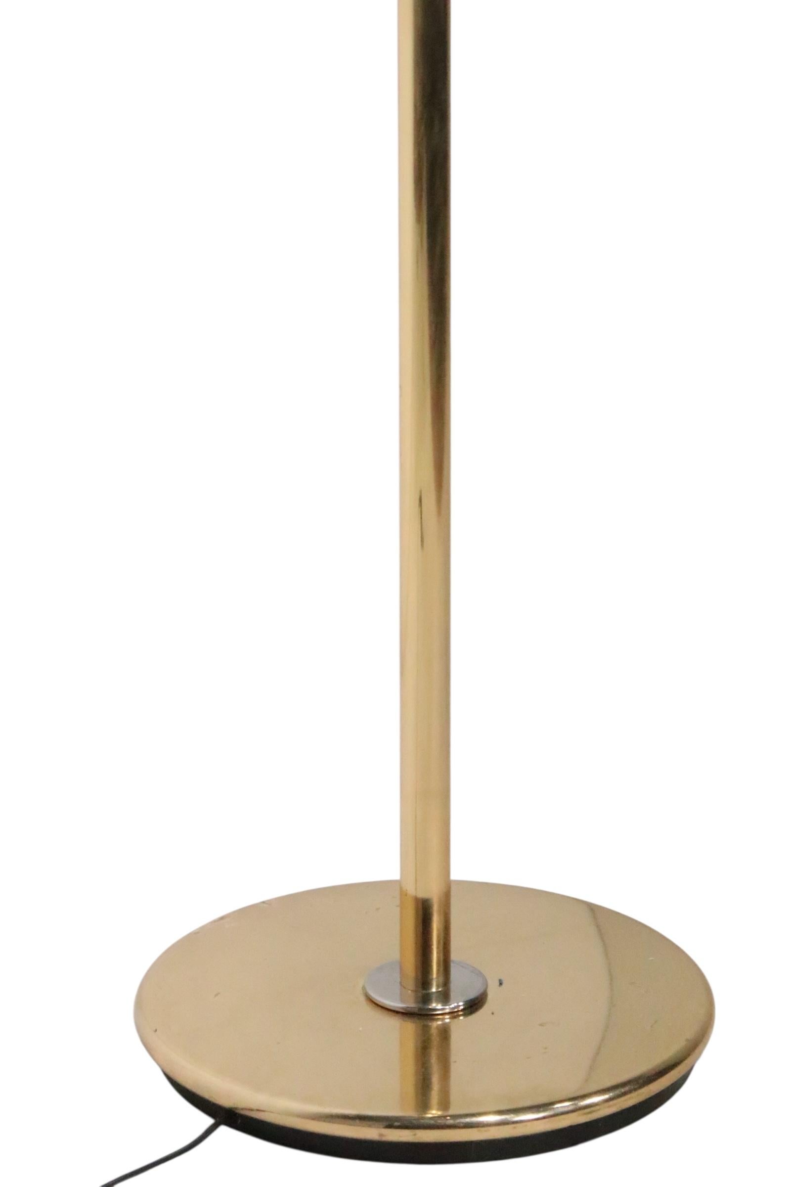 Elegant, sophisticated and chic, this postmodern, Hollywood Regency uplight, torchiere floor lamp is in very good, original, clean and ready to use condition, showing only light cosmetic wear, normal and consistent with age.  The brass plated bowl