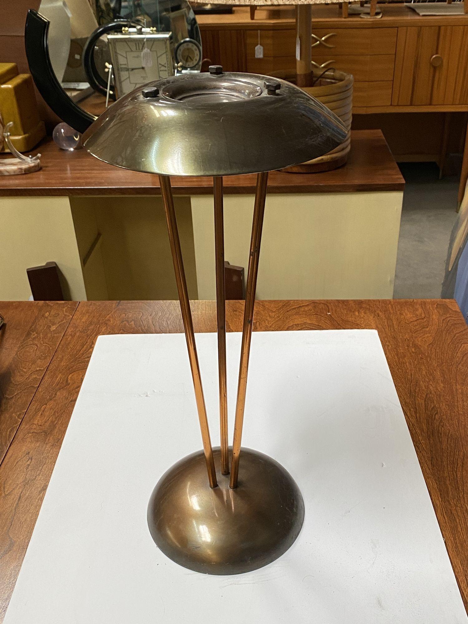 Circa 1930 Machine Age floor standing ashtray featuring a bronze have cut spere base with 3 copper Spidel arms connect to a spherical top. The ashtray is reminiscent of designers of the period like Walter Von Nessen with simple shapes made from