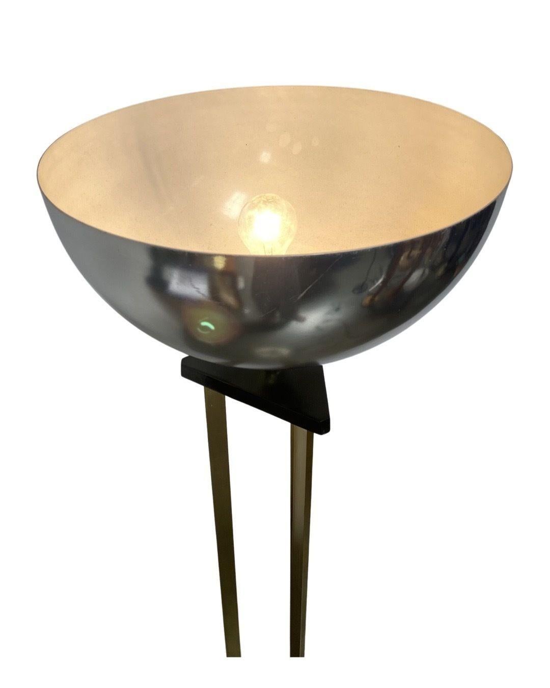 A unique art deco torch lamp with a marble base. Features chrome shade and brass tri-pillar body. In great condition and comes with a fully functional dimmer.

Circa 1980, USA

MARCSS
