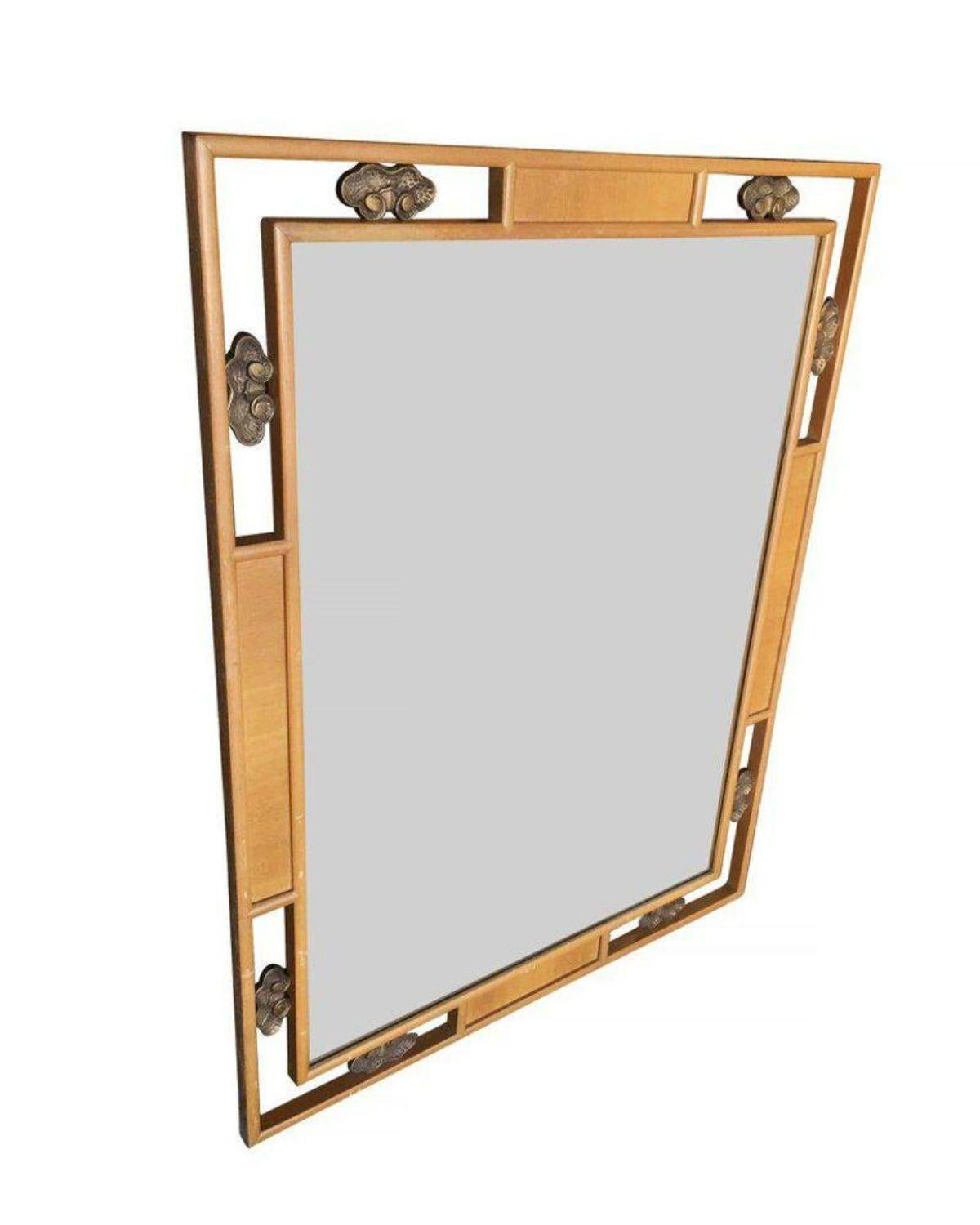 High style mid-century wall mirror with a unique double hardwood frame and bronze accents.