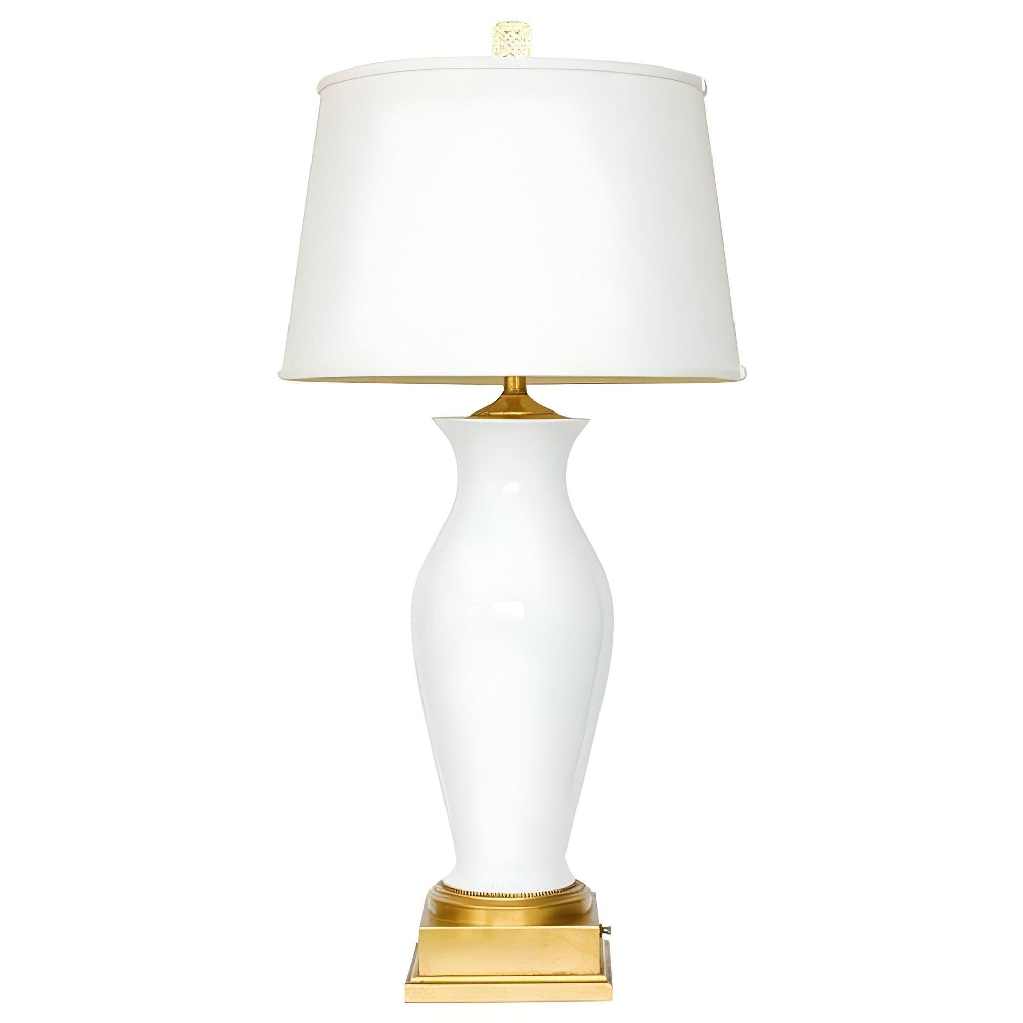 High Style Mid-century era white porcelain table lamp with gold leaf and the lampshade pictured. The epitome of classic simplicity on a grand scale, featuring a classic yet minimalist that adds a touch of classical design to the most modern settings