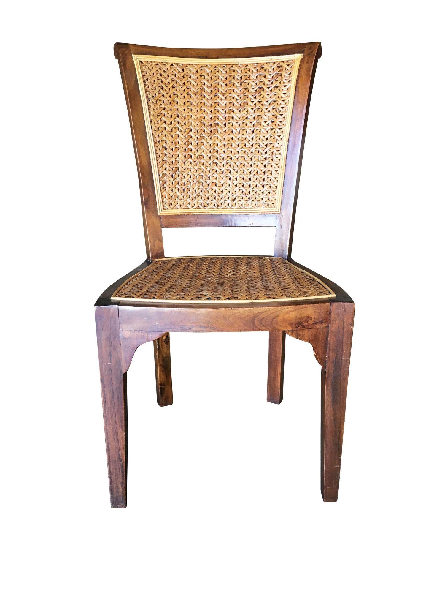 High style midcentury mahogany formal dining chair with woven wicker seat.