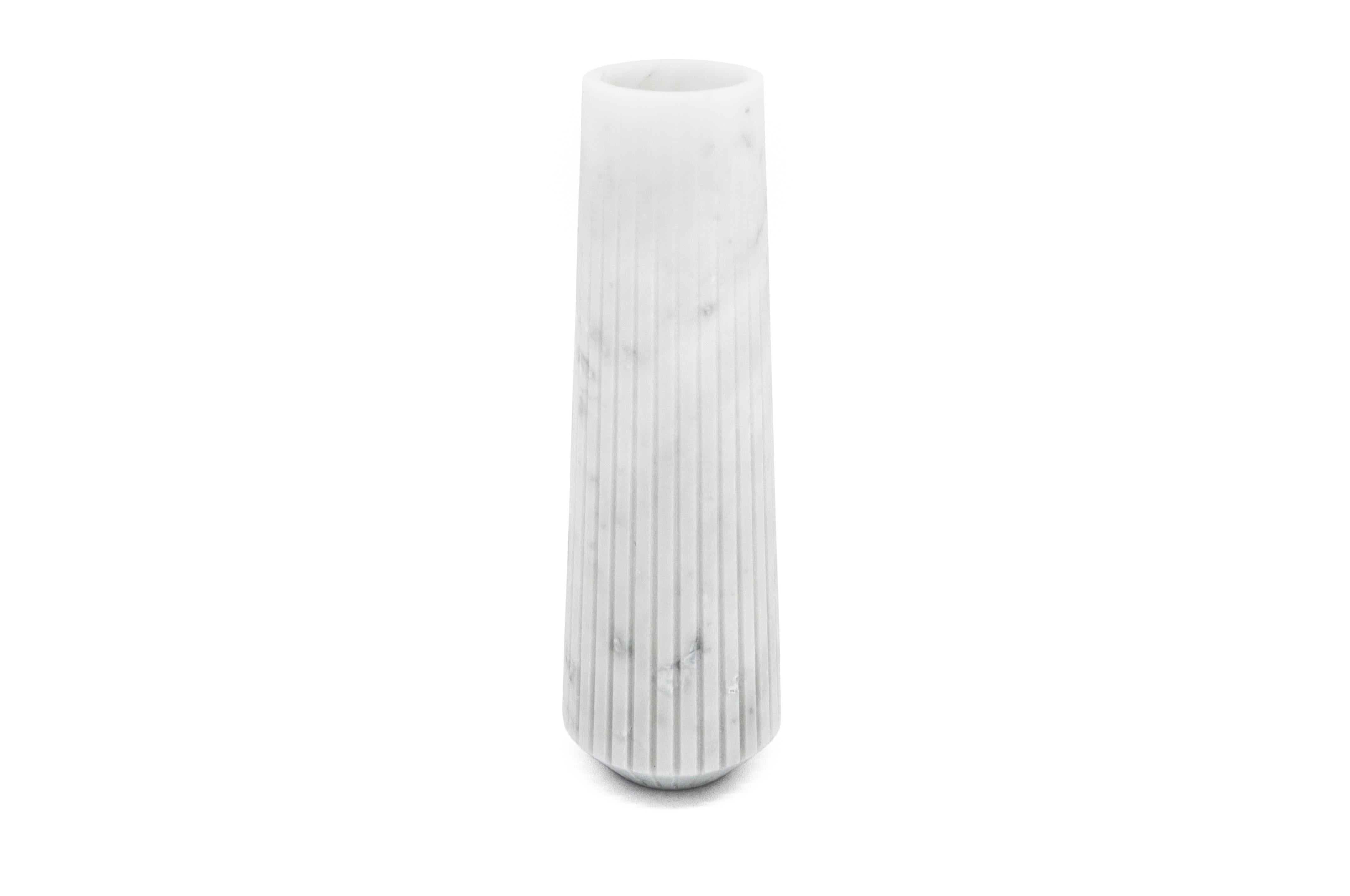 High striped vase in white Carrara marble.
-Jacopo Simonetti design for FiammettaV-
Each piece is in a way unique (every marble block is different in veins and shades) and handmade by Italian artisans specialized over generations in processing