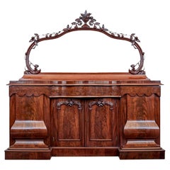 Antique High Victorian shaped flame mahogany mirror topped sideboard