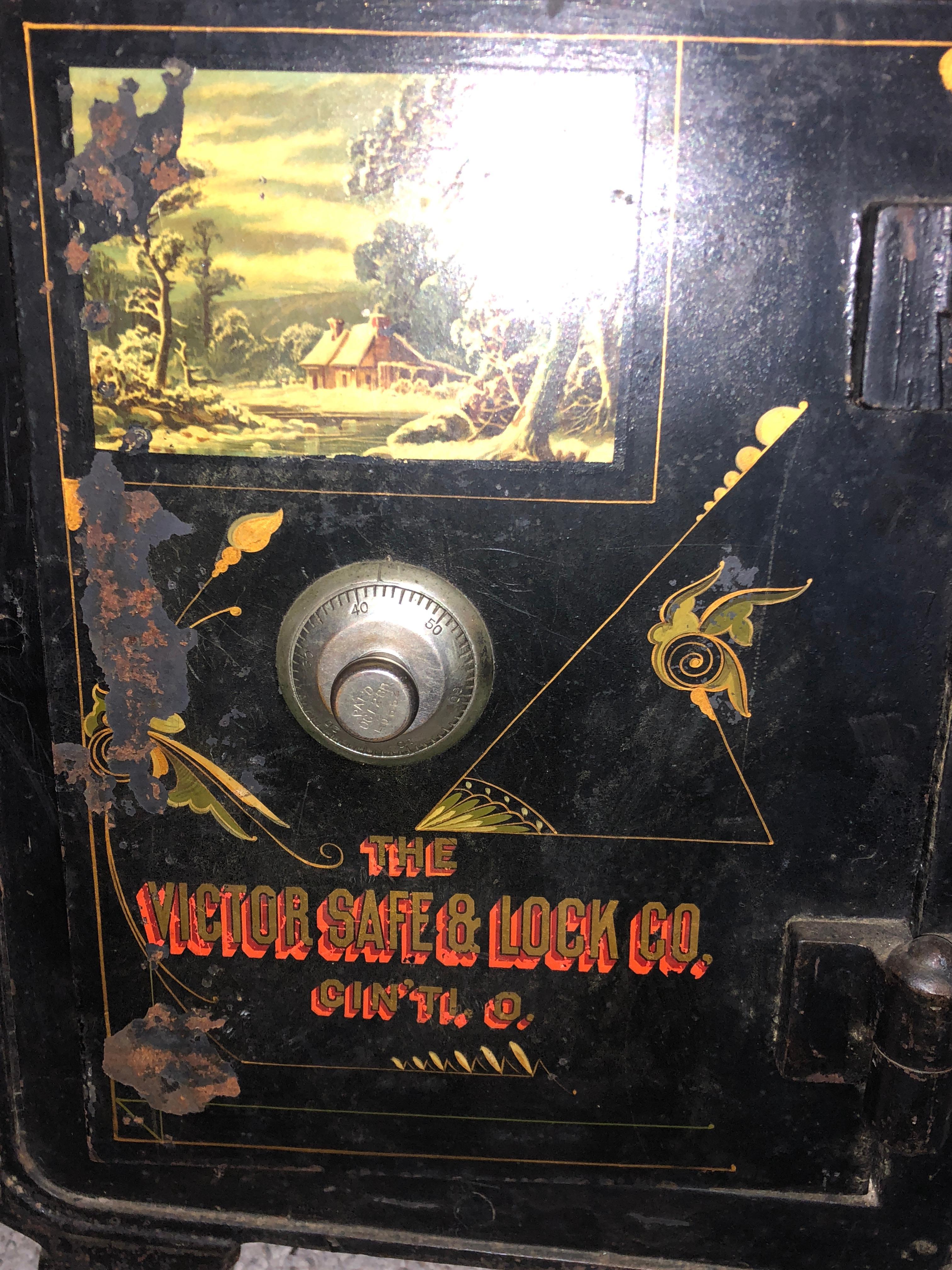 Painted award wining high Victorian Victor floor safe on demi wheels with combination and working key secret door inside. All original. In very good condition. Weighs 150lb. A Victorian collectors item.