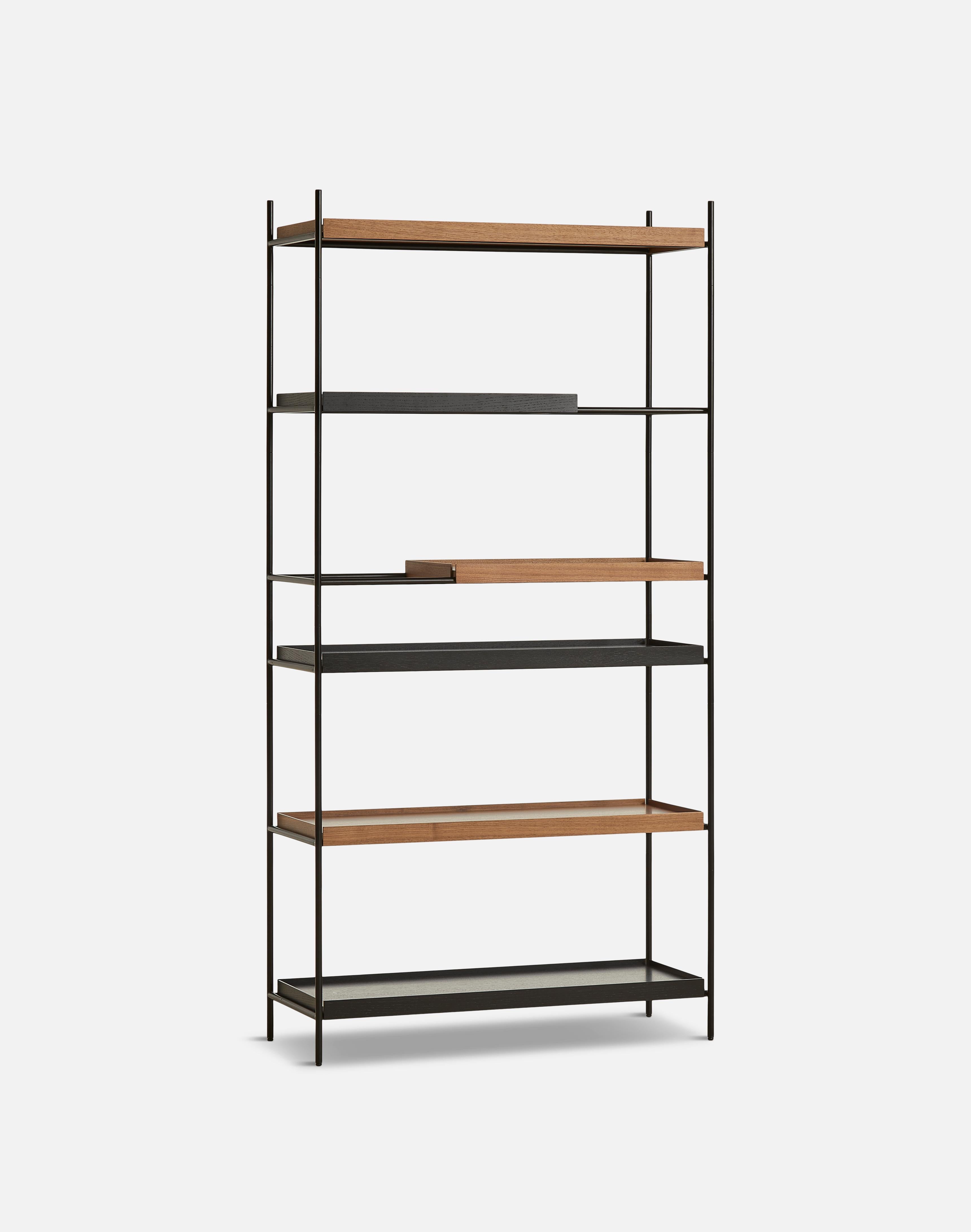 High walnut and black tray shelf I by Hanne Willmann
Materials: Metal, walnut.
Dimensions: D 40 x W 100 x H 201 cm
Also available in different tray conbinations and 2 sizes: H81, H 201 cm.

Hanne Willmann is a dynamic German designer with her