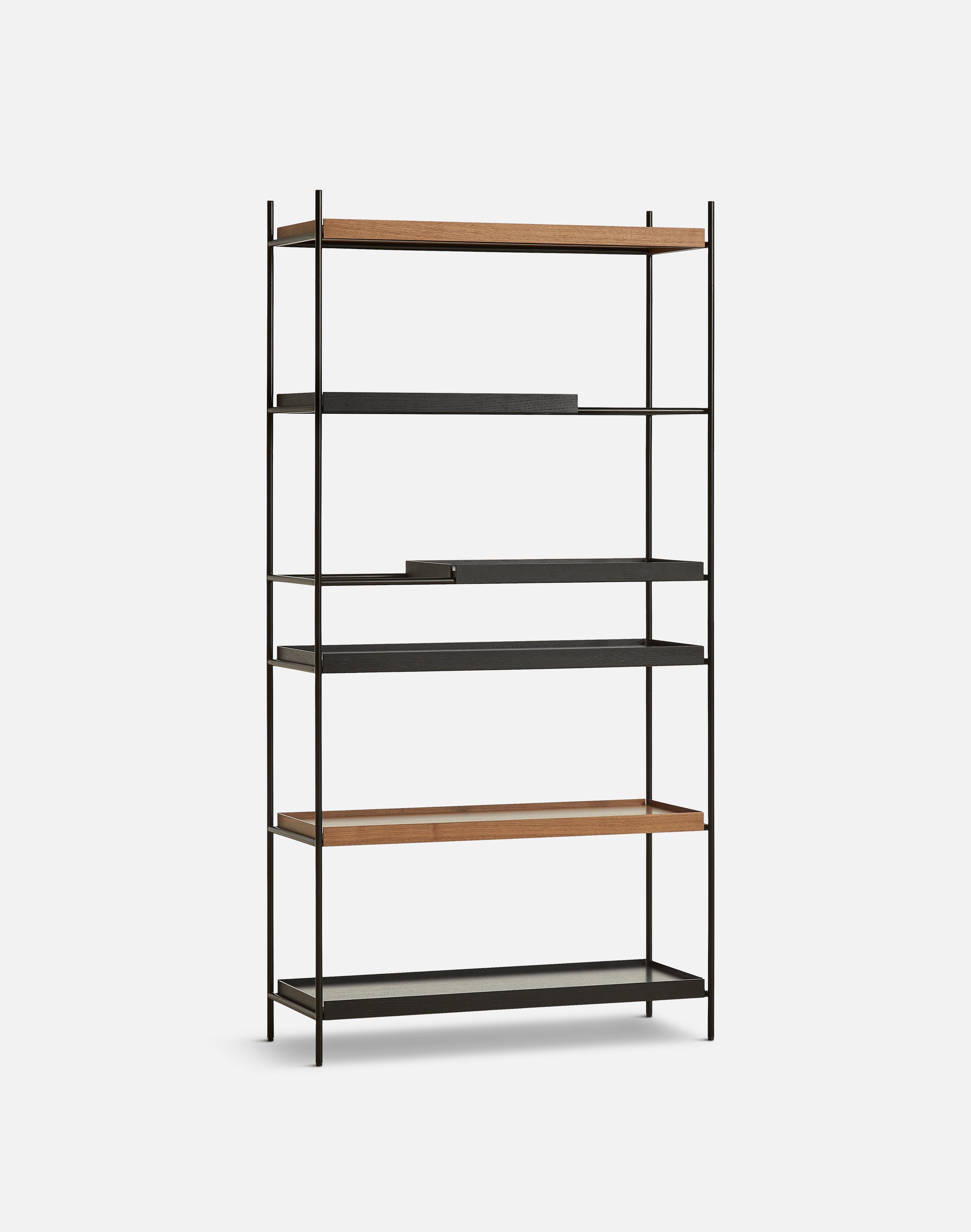 High walnut and black tray shelf II by Hanne Willmann.
Materials: metal, walnut.
Dimensions: D 40 x W 100 x H 201 cm.
Also available in different tray conbinations and 2 sizes: H81, H 201 cm.

Hanne Willmann is a dynamic German designer with