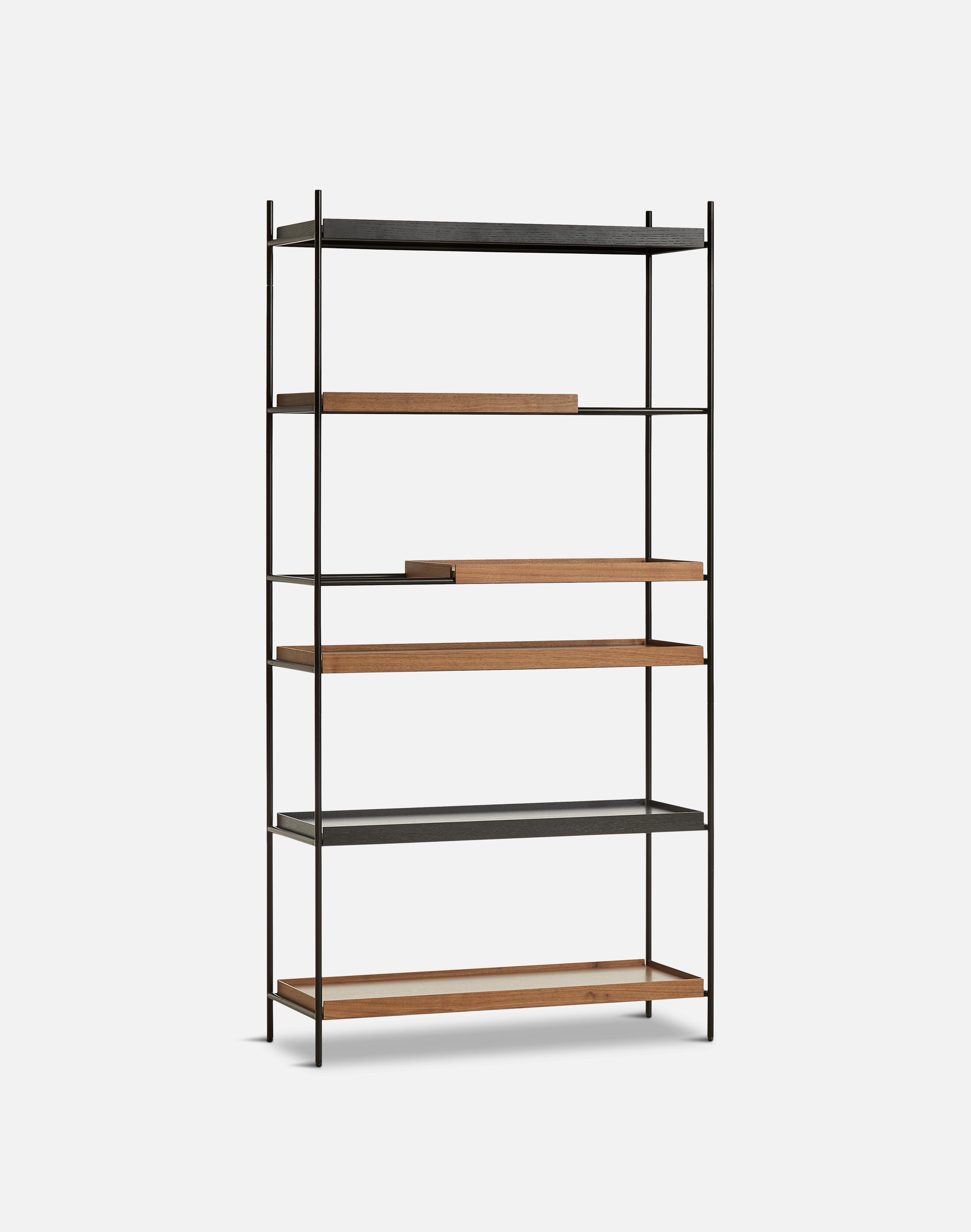 High walnut and black tray shelf III by Hanne Willmann.
Materials: metal, walnut.
Dimensions: D 40 x W 100 x H 201 cm
Also available in different tray conbinations and 2 sizes: H 81, H 201 cm.

Hanne Willmann is a dynamic German designer with