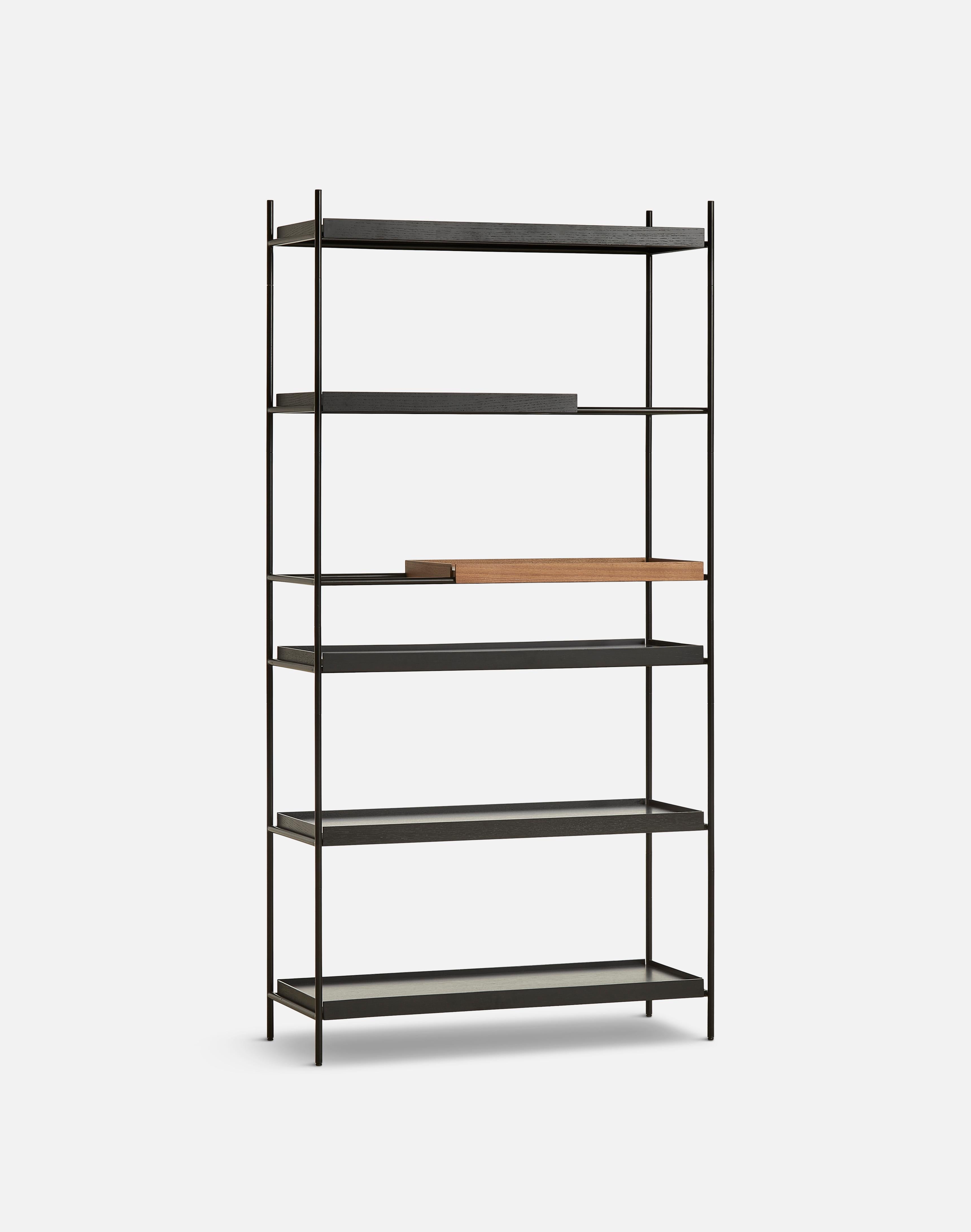 High walnut and black tray shelf IV by Hanne Willmann.
Materials: Metal, walnut.
Dimensions: D 40 x W 100 x H 201 cm.
Also available in different tray conbinations and 2 sizes: H81, H 201 cm.

Hanne Willmann is a dynamic German designer with