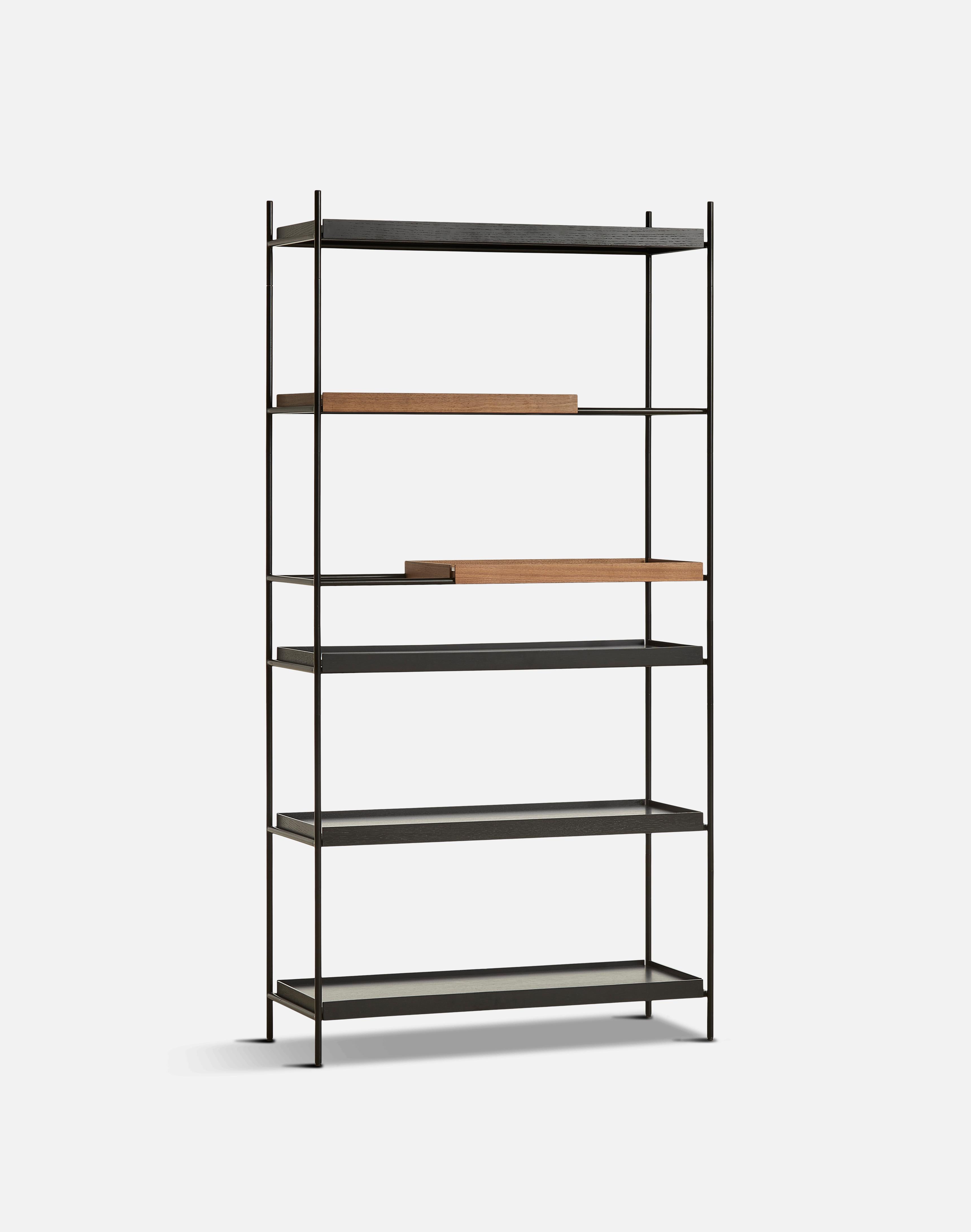 High walnut and black tray shelf VI by Hanne Willmann.
Materials: metal, walnut.
Dimensions: D 40 x W 100 x H 201 cm.
Also available in different tray conbinations and 2 sizes: H81, H 201 cm.

Hanne Willmann is a dynamic German designer with