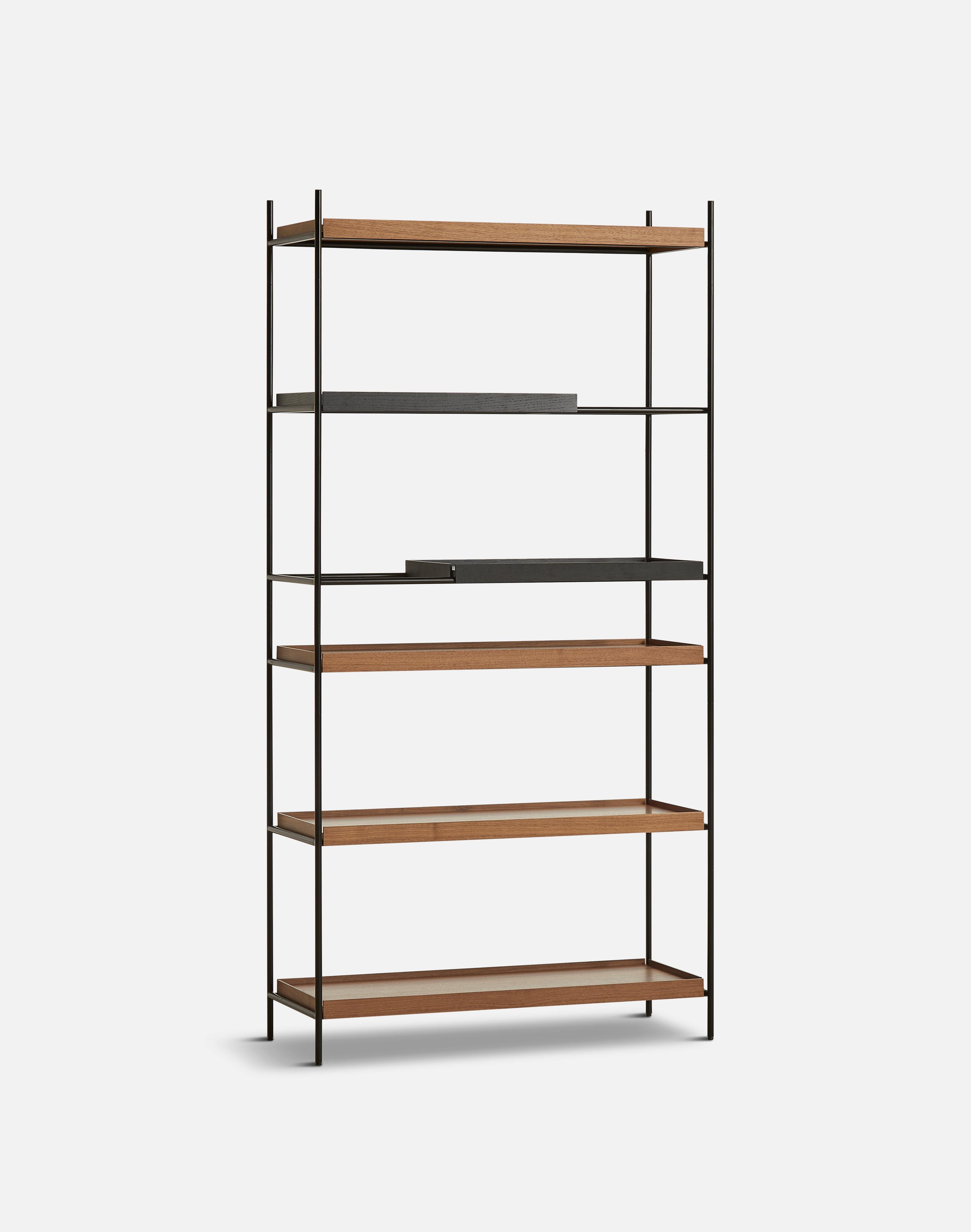 High walnut and black tray shelf VII by Hanne Willmann.
Materials: Metal, walnut.
Dimensions: D 40 x W 100 x H 201 cm.
Also available in different tray conbinations and 2 sizes: H81, H 201 cm.

Hanne Willmann is a dynamic German designer with