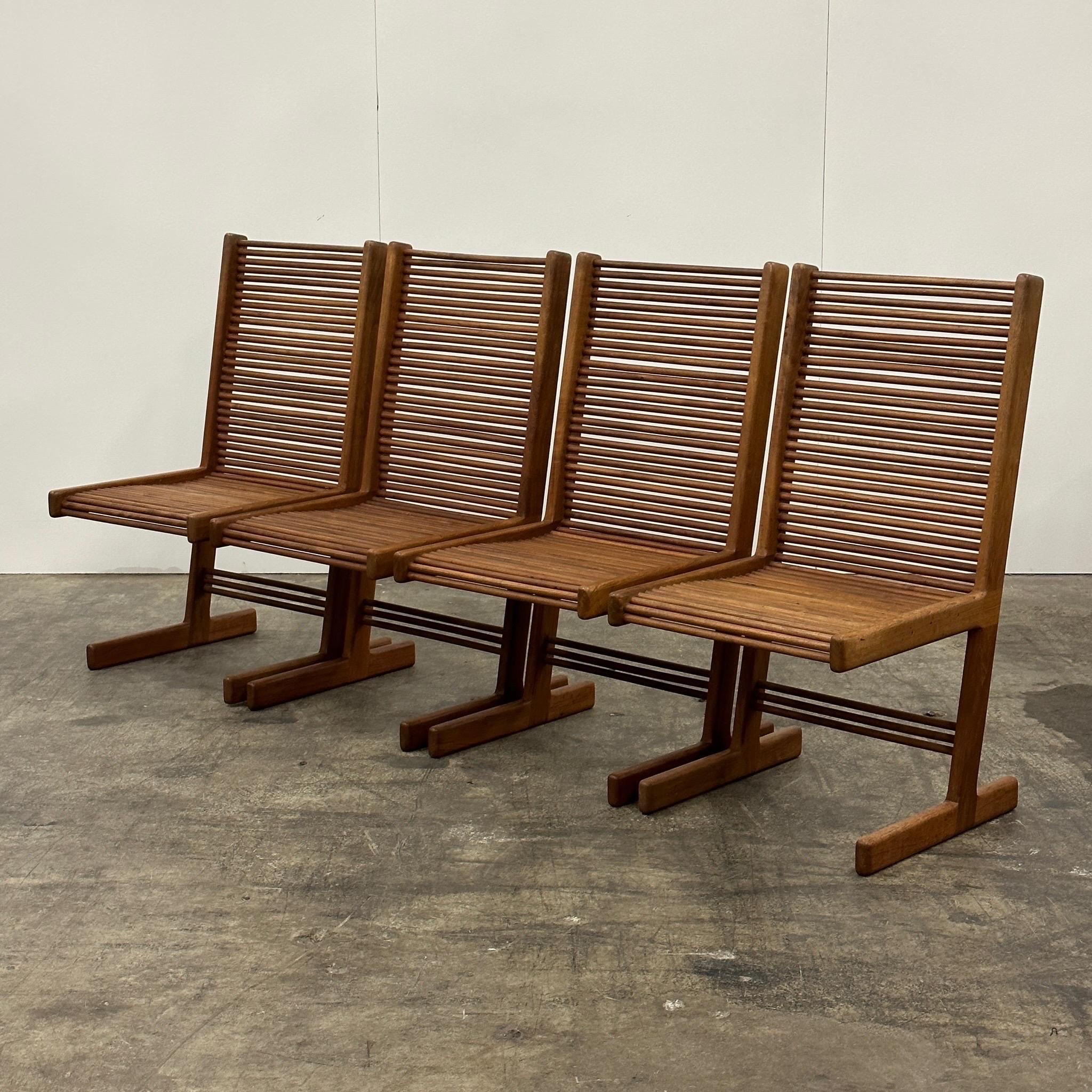 c. 1980s. Price is for the set. Contact us if you’d like to purchase a single item. Set of 6 wood dining chairs, including four armless chairs and two captains chairs. Studio made of oak.
