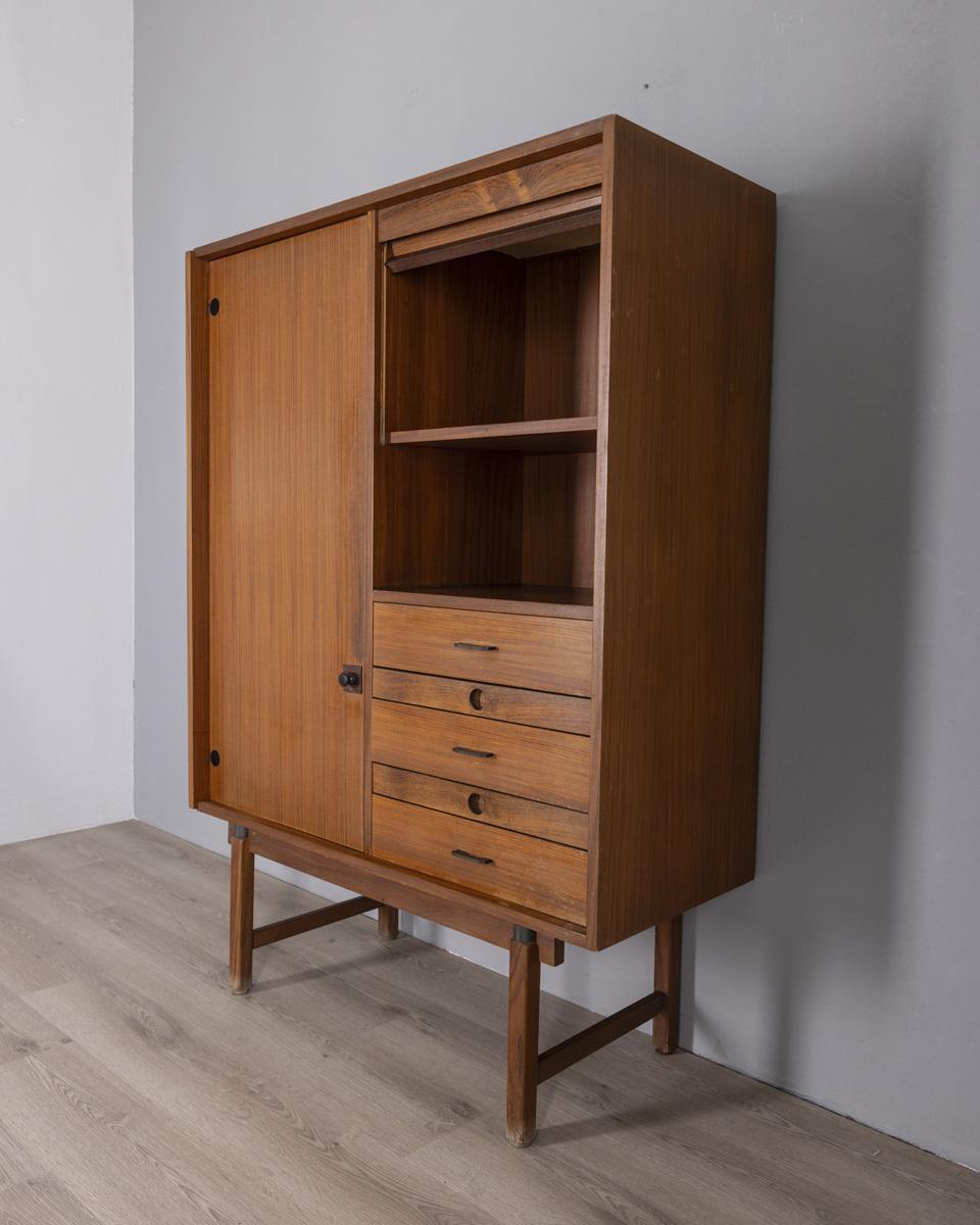 Tall sideboard with hinged door, five drawers and a compartment with shutter, designed by Barovero, 1960s.

CONDITION:
In good condition, shows signs of wear due to age.

SIZING:
Height 150 cm; width 107 cm; depth 44 cm;

MATERIALS:
Wood.

YEAR OF