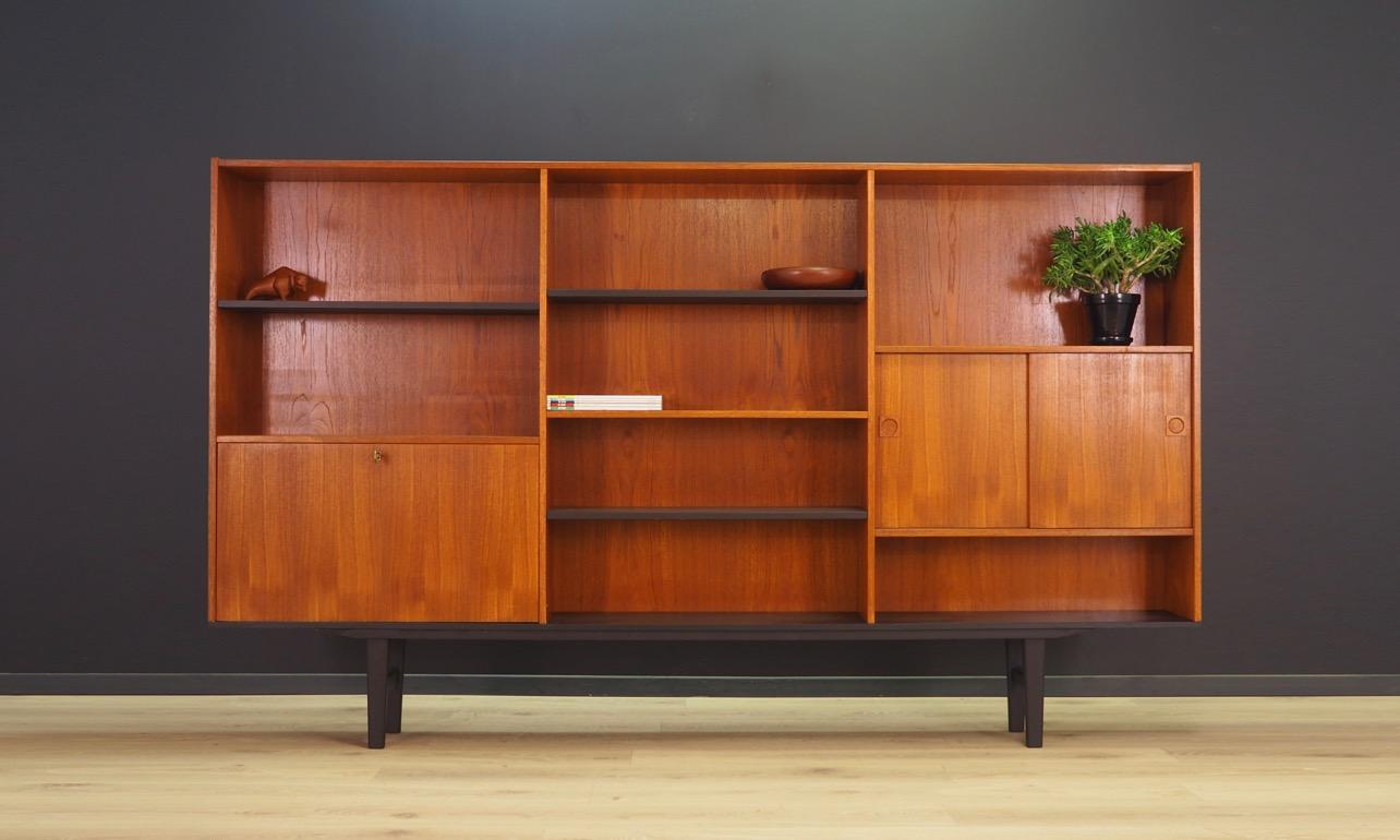 Minimalistic highboard from the 1960s-1970s, Danish design, phenomenal form. Surface veneered with teak. The furniture has a shelf behind the sliding doors, and a bar. The key in the set. Preserved in good condition (small bruises and scratches) -
