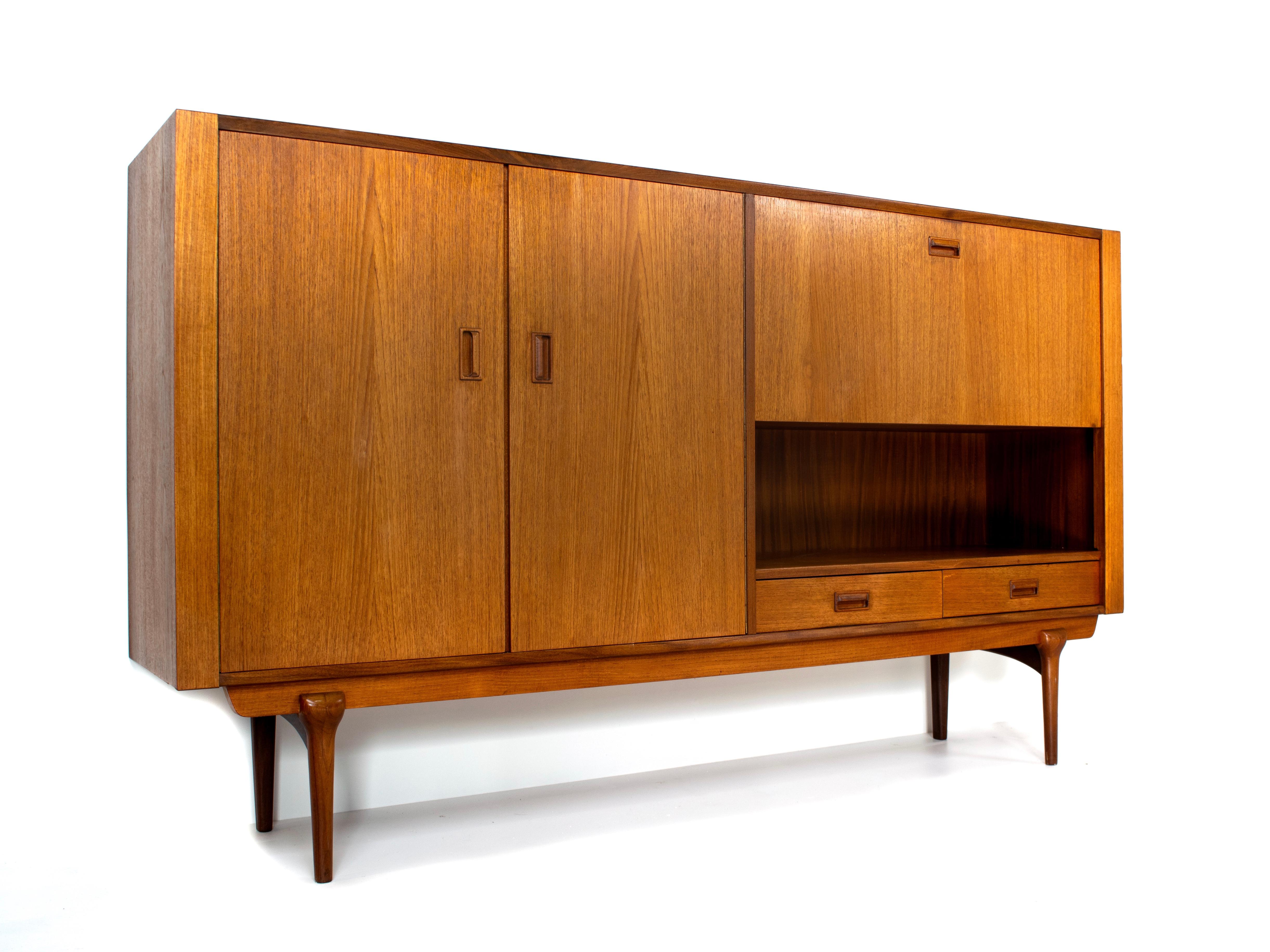 Nice highboard in teak by Topform, The Netherlands, 1960s. This highboard has the very recognizable Dutch style that is inspired by Danish design of that time. Famous designer Louis van Teeffelen designed a lot of furniture for Topform and this