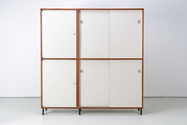 Design classic from the modular furniture system model M 125 designed by Hans Gugelot. The highboard has two lockable compartments. Very good vintage condition with slight signs of wear.