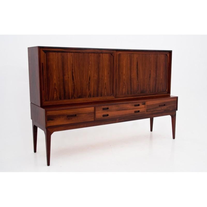 The Highboard designed by Severin Hansen. The whole is covered with rosewood veneer. H
as a spacious interior, shelves and drawers behind sliding doors. 
Preserved in excellent condition, it has undergone the process of wood renovation.