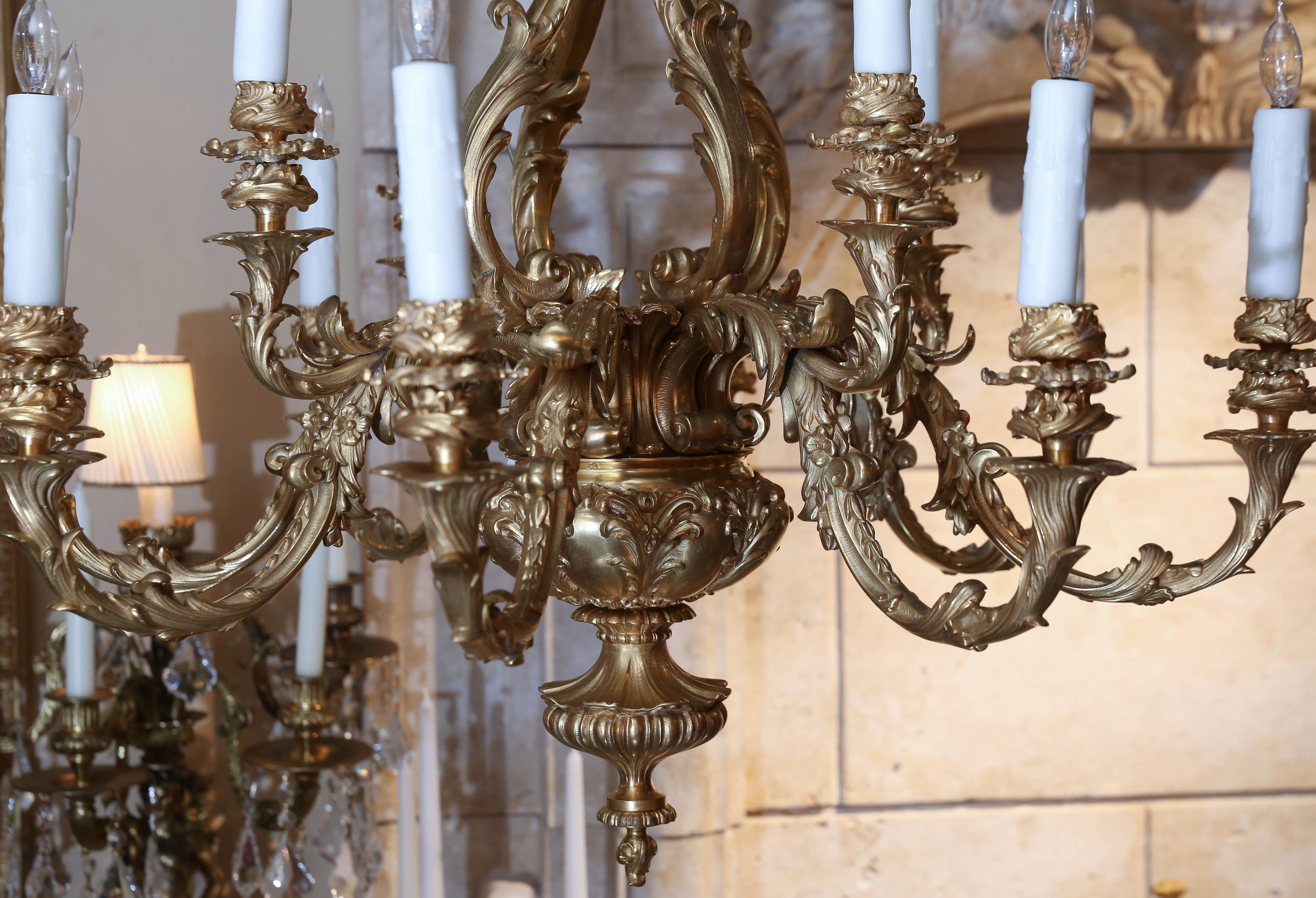 Exceptional twelve-light chandelier in bronze doré
Lovely casting and the gilding is of the highest quality.