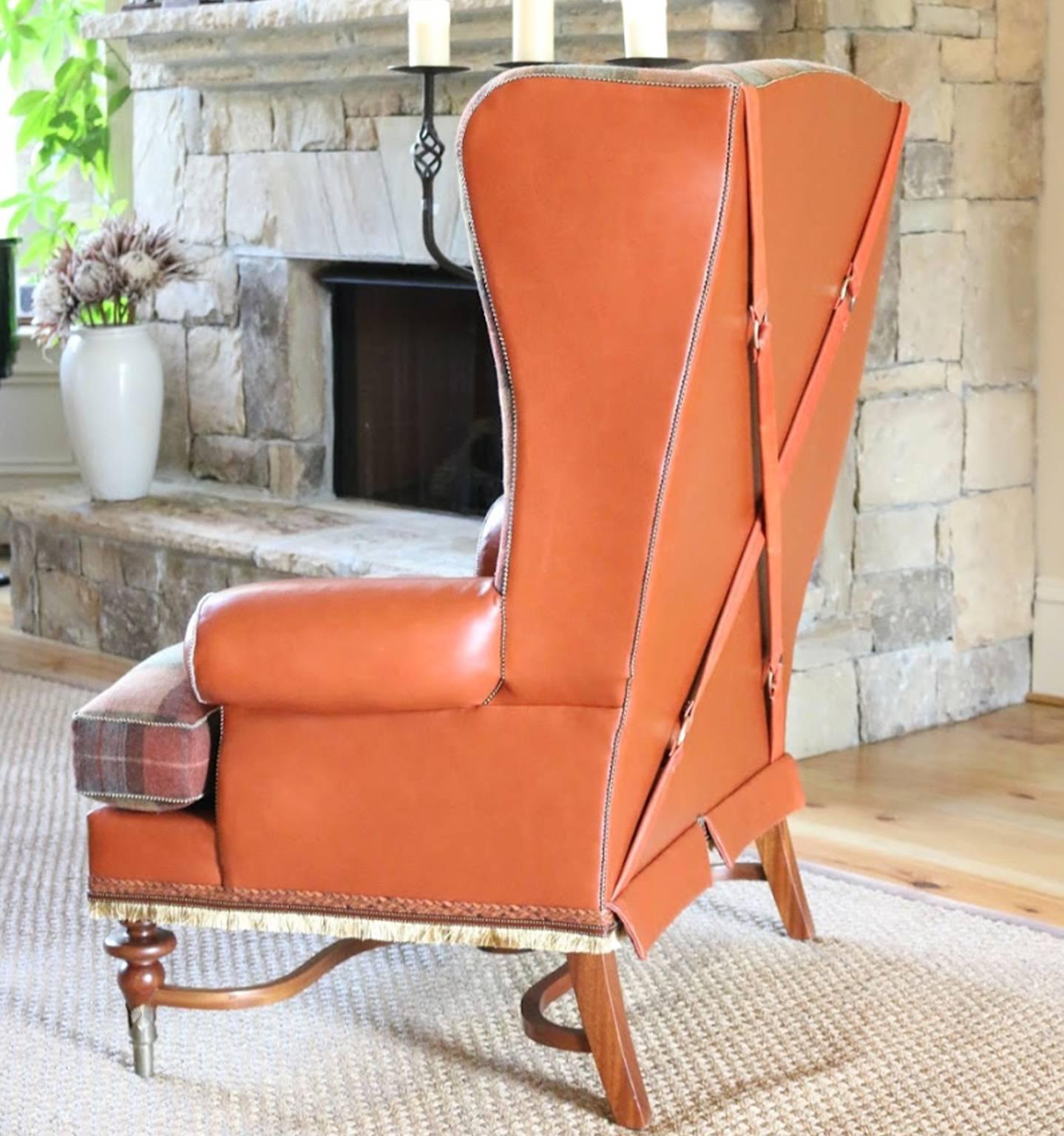 Our one of a kind Highland wing chair with its exposed wood carved legs and struts encased in bronze ferrules handcrafted in Providence, with wide, deeply cut regal wings. Tight back and loose cushion down seat. A contemporary twist on carved