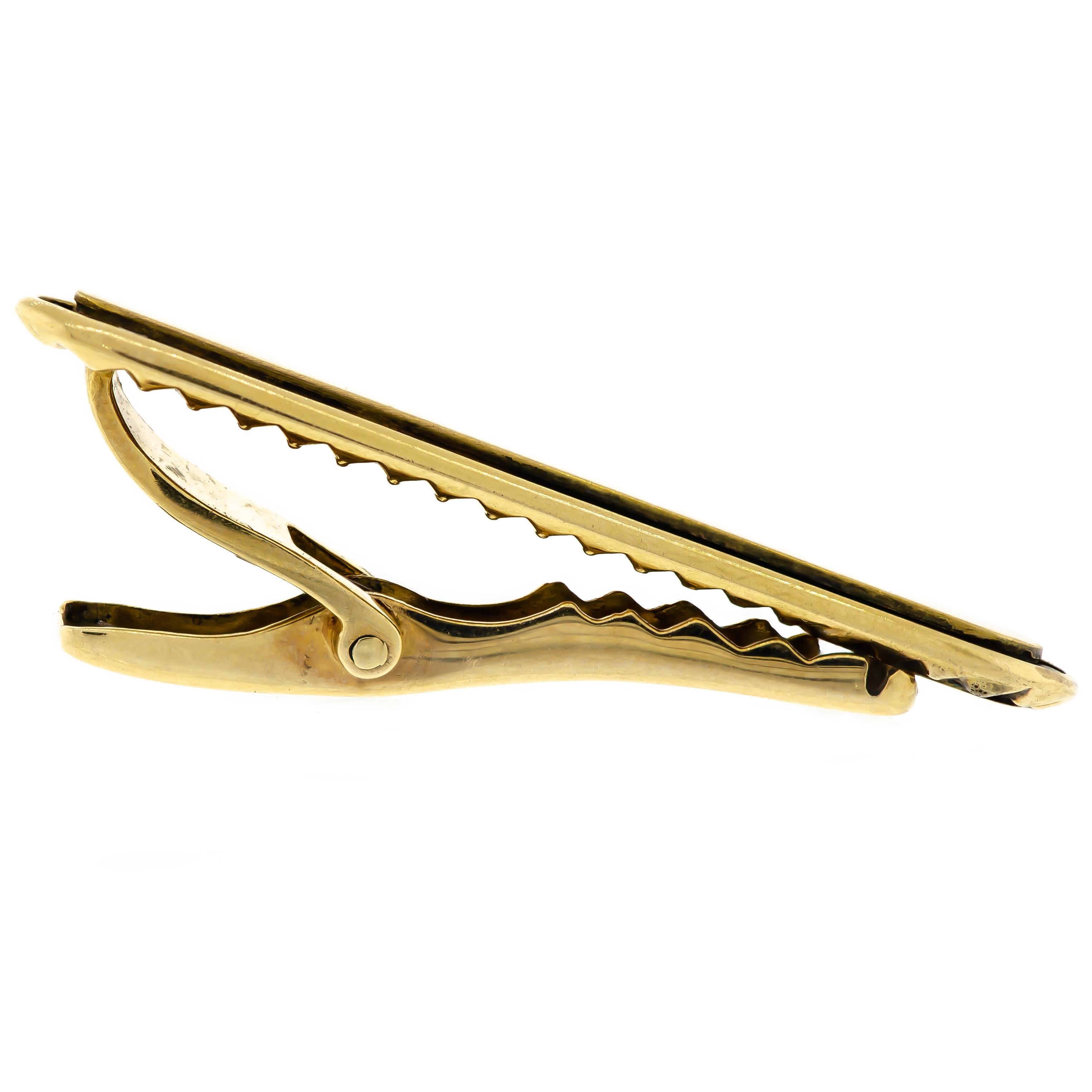 Attractive Mid Century Garnet 14K yellow gold tie clip by Lucien Piccard (trademark along with quality mark) in excellent condition border of deep red garnets set in matte brushed finish 14k yellow gold mount - 1 5/8 inches in length -  reverse gold