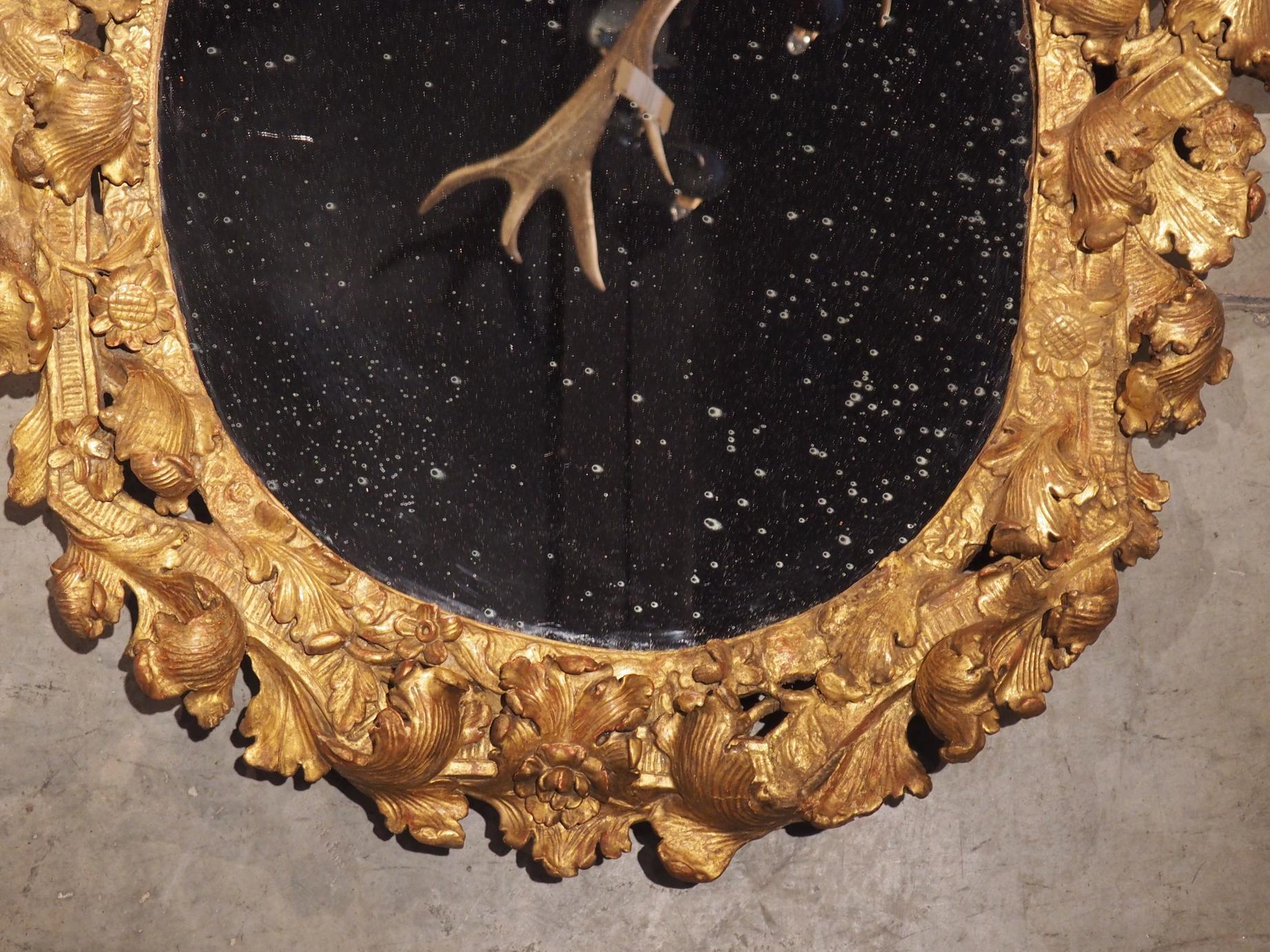 Highly Carved 17th Century Giltwood Mirror from France 13
