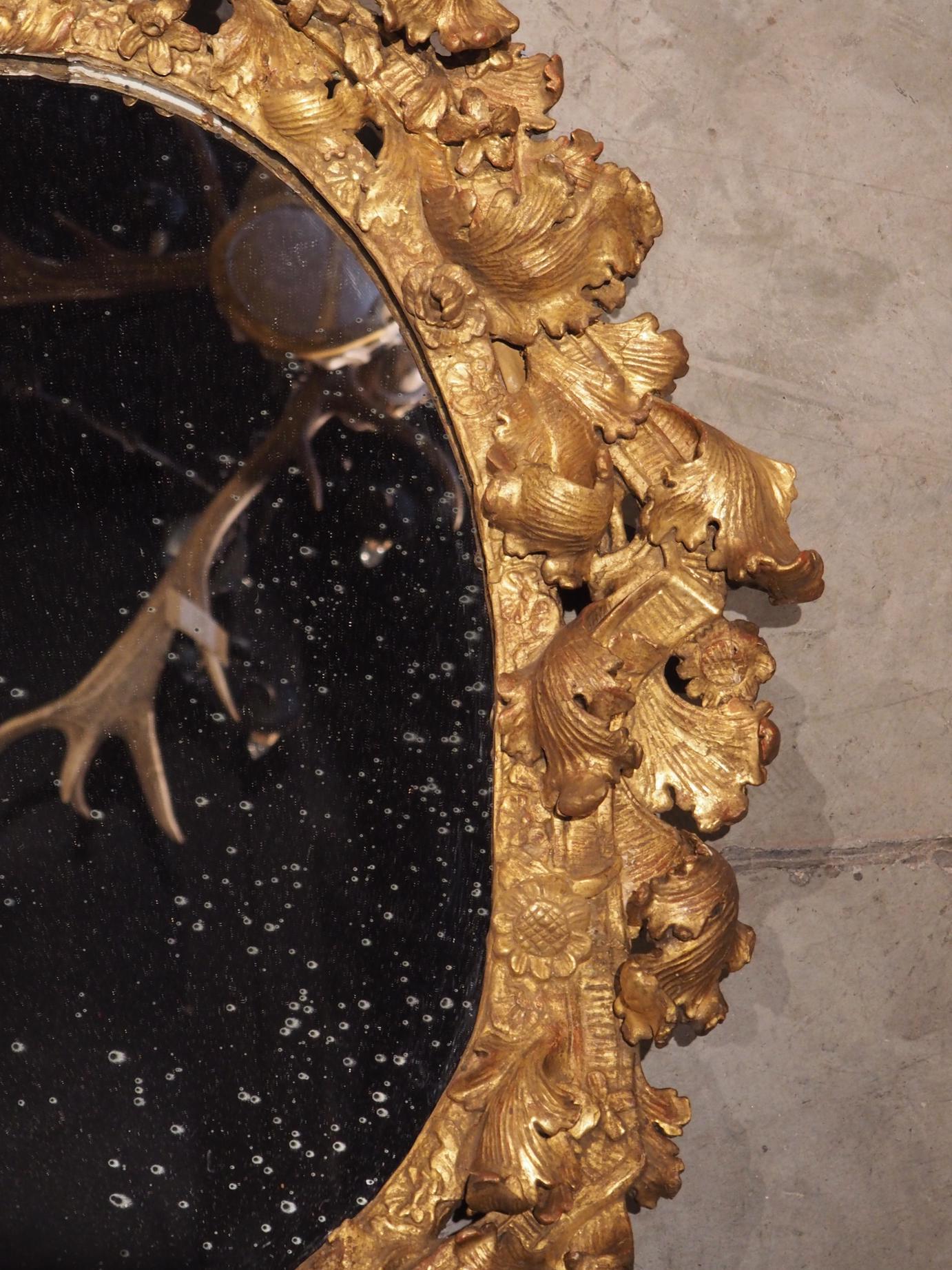 Highly Carved 17th Century Giltwood Mirror from France 14