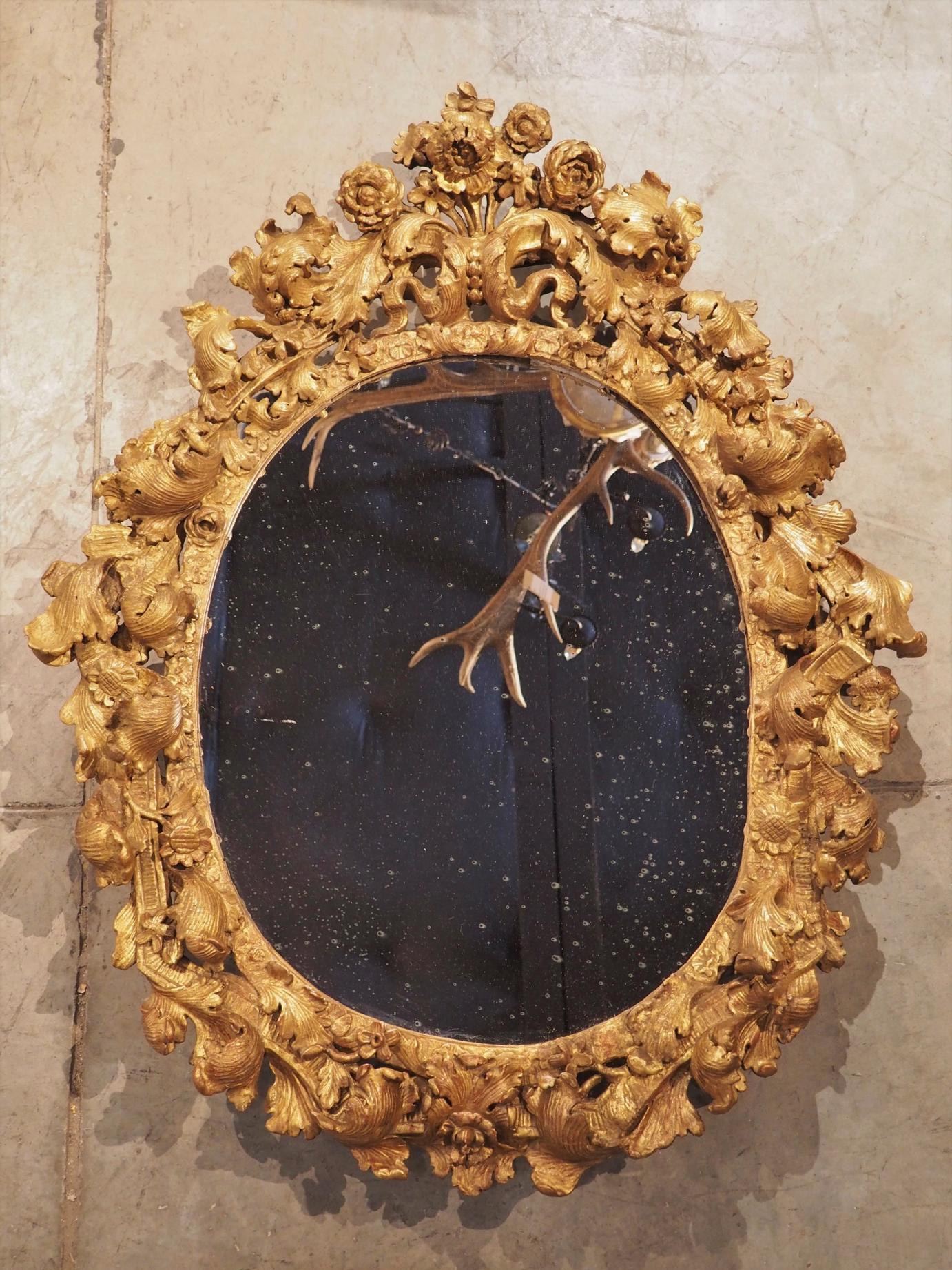Highly Carved 17th Century Giltwood Mirror from France 15