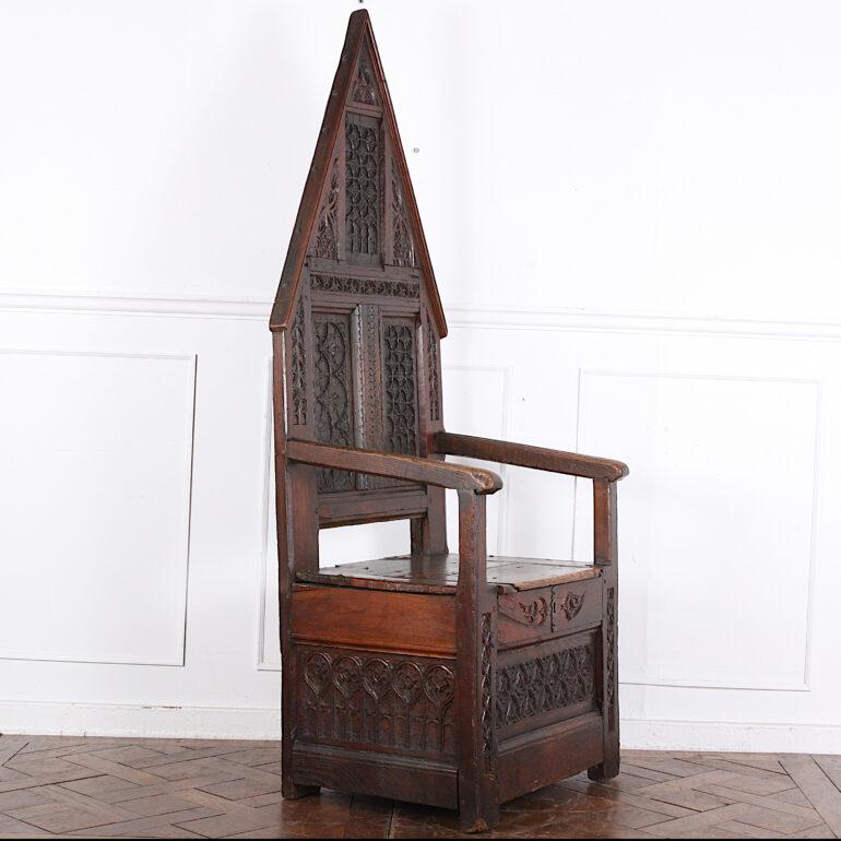 Highly-carved Gothic ‘Bishop’s’ chair of remarkable age- hard to date precisely but the wear and depth of patina suggest two to three hundred years or more. Lovely color and character to this piece of mixed woods- oak, cherry, chestnut and walnut