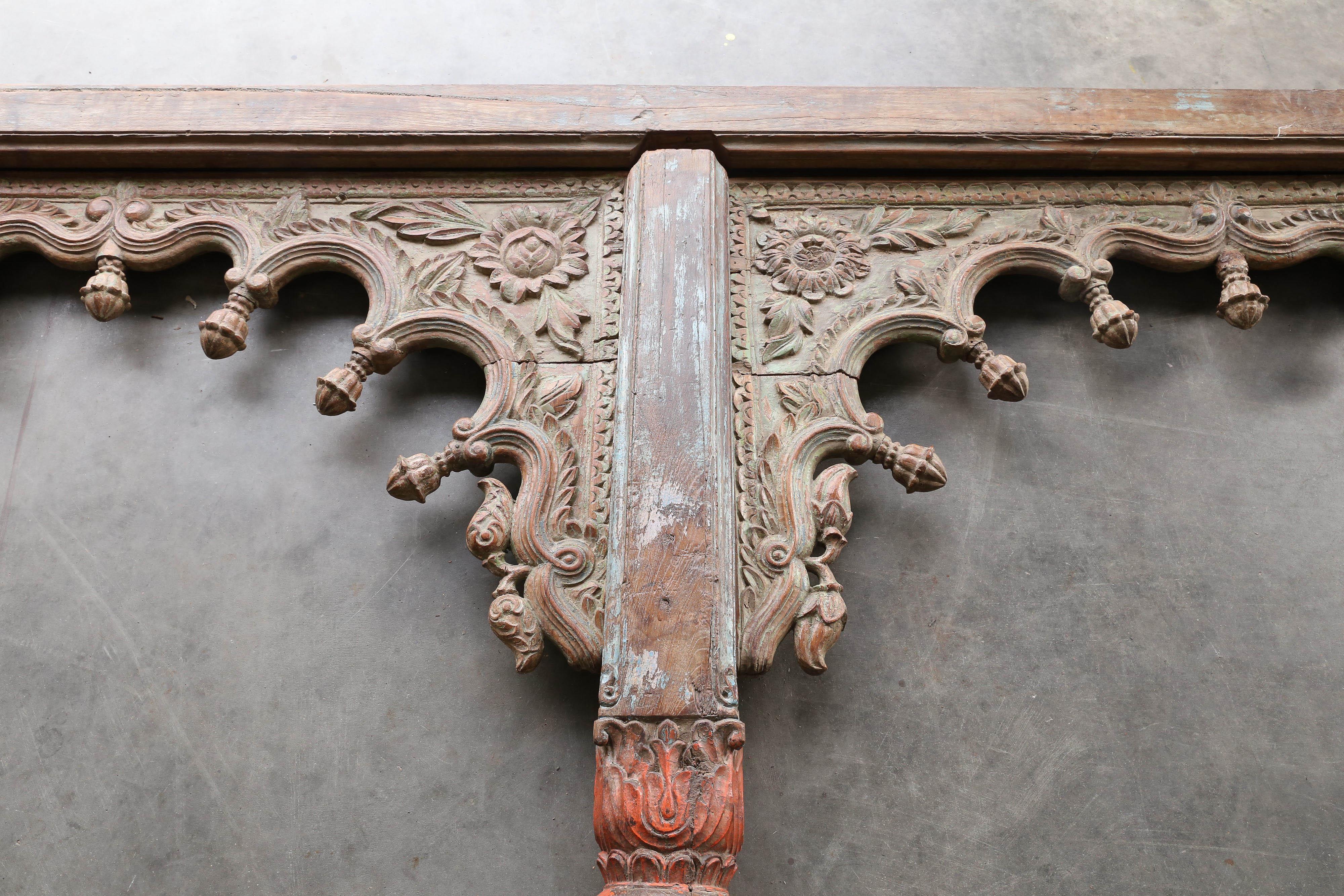 This four arch impeccably hand-carved panel comes from a second floor balcony of a local chieftain home in Ajmer. The sharp and deep carvings on the arches exemplifies the best in Rajasthan artwork. This four arch panel can be used in many different