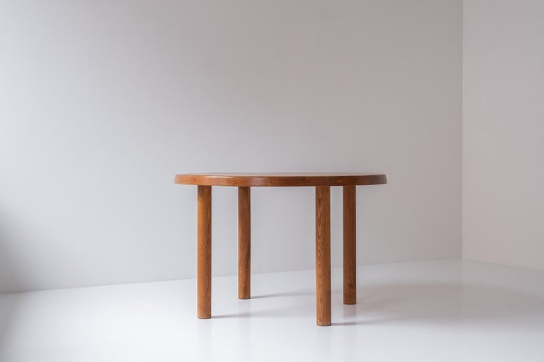Admire this early edition ‘T02’ dining table by Pierre Chapo, designed and manufactured in his own workshop in France around 1962. This piece is fully handmade in solid elm wood and has a rich and warm overall patina. Well presented and original