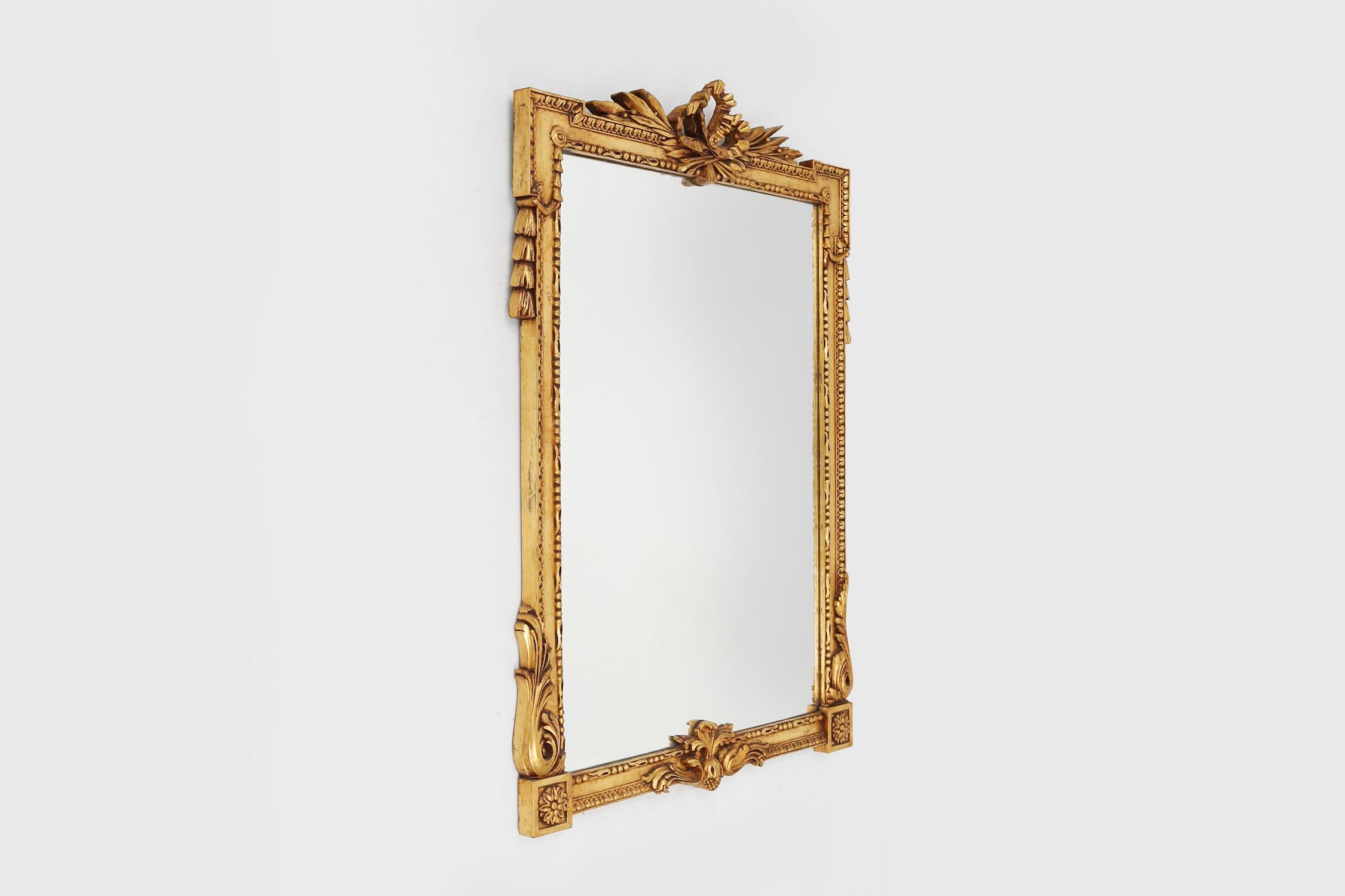 Mid-Century Modern Highly decorated gilted carved wooden wall mirror, Belgium ca. 1950 For Sale