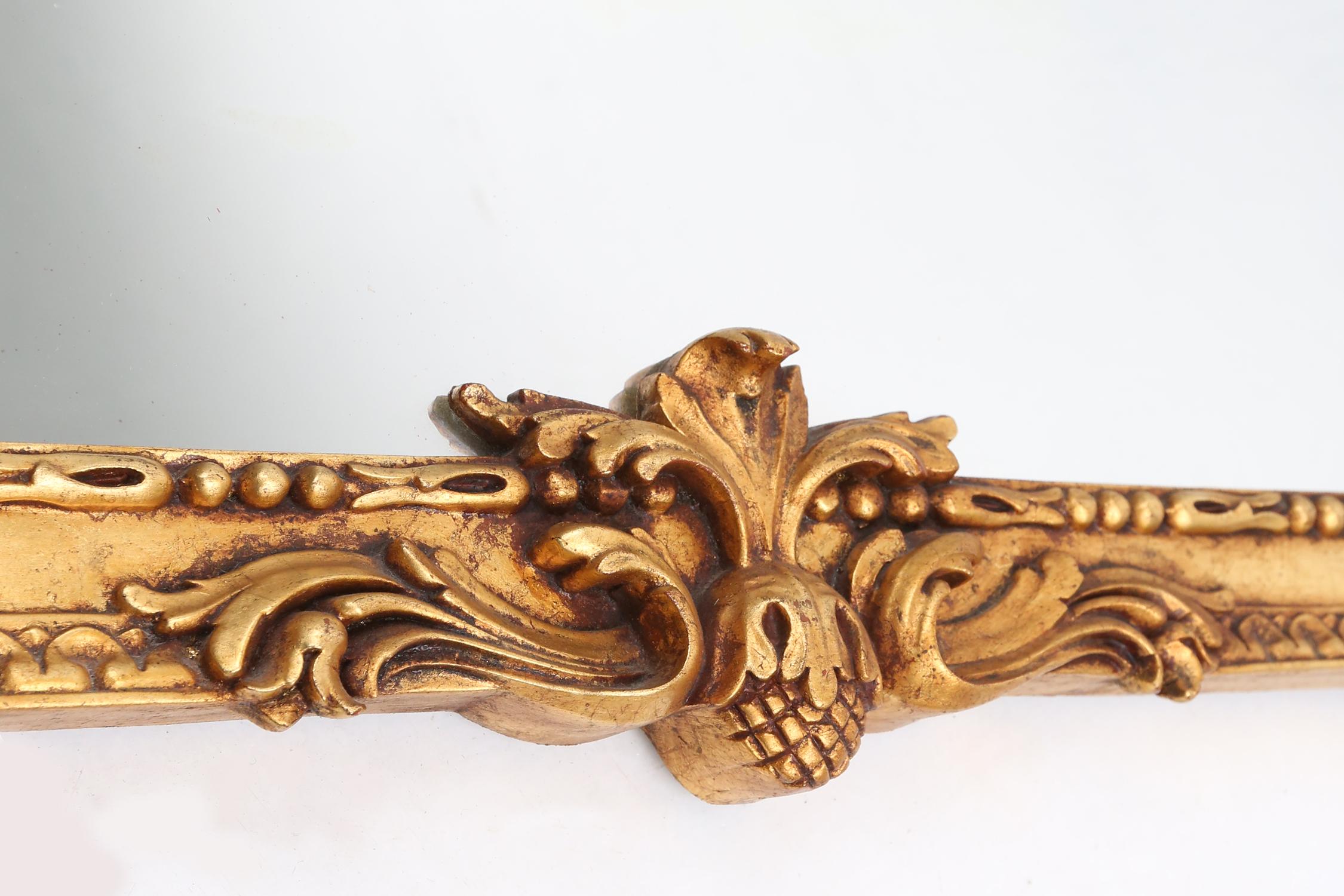 Gilt Highly decorated gilted carved wooden wall mirror, Belgium ca. 1950 For Sale