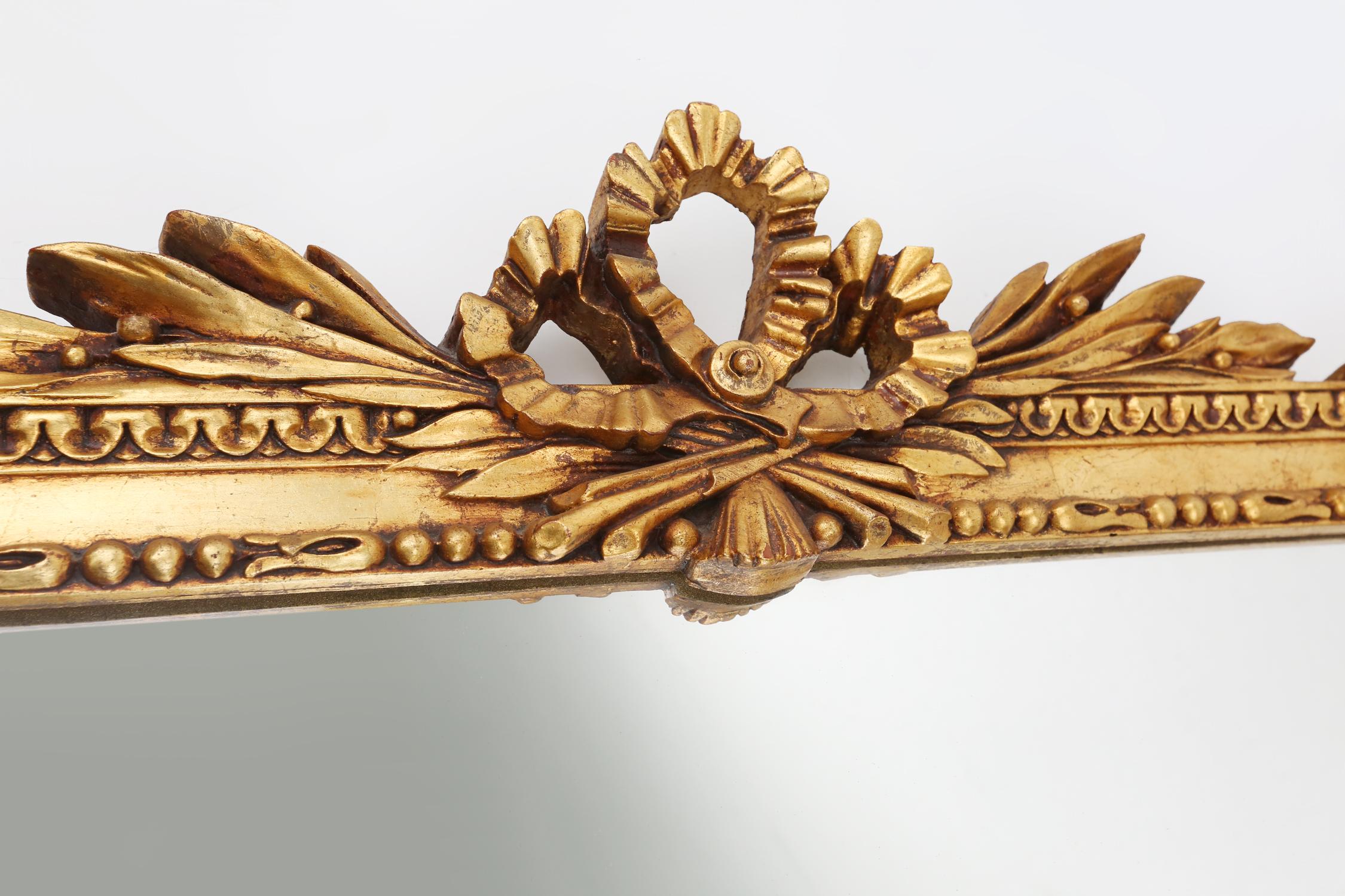 Mid-20th Century Highly decorated gilted carved wooden wall mirror, Belgium ca. 1950 For Sale