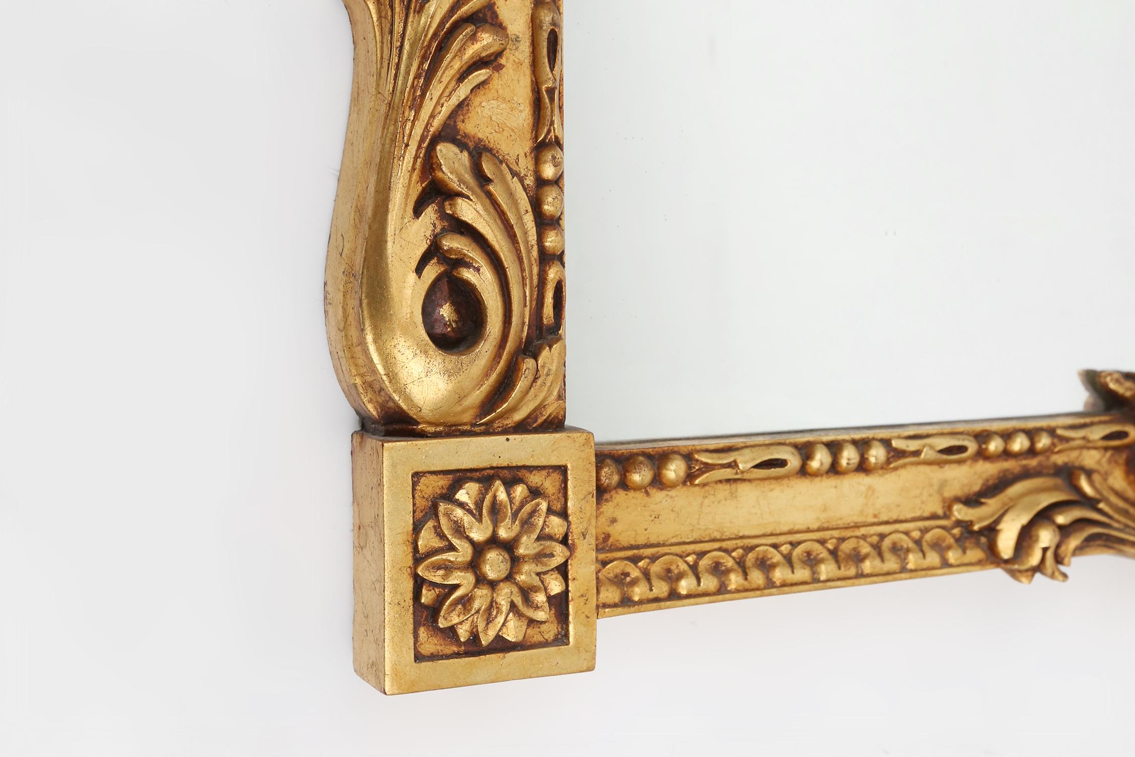 Mirror Highly decorated gilted carved wooden wall mirror, Belgium ca. 1950 For Sale