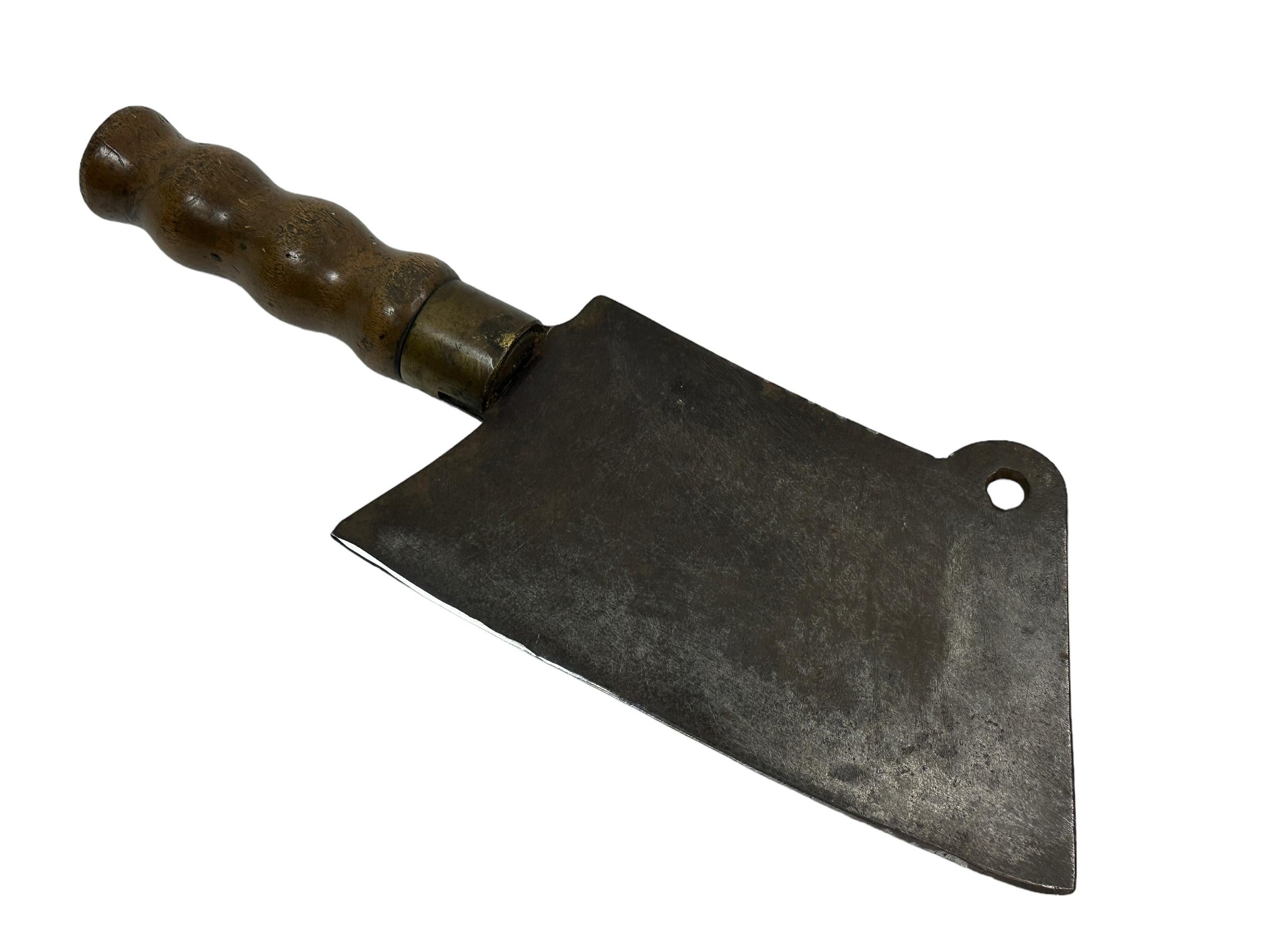 Antique 19th century European cleaver. Made from hand-wrought iron with wood handle. Great as a graphic wall decoration. Found at an estate sale in Nuremberg, Germany. Nice to display with your Butcher Block or to use in your Country Style Kitchen. 